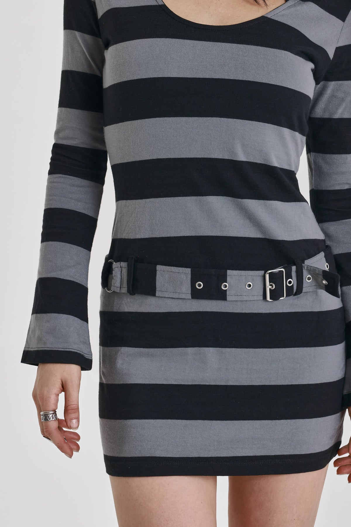 Black and grey stripe hooded mini dress with eyelet belt, worn by model