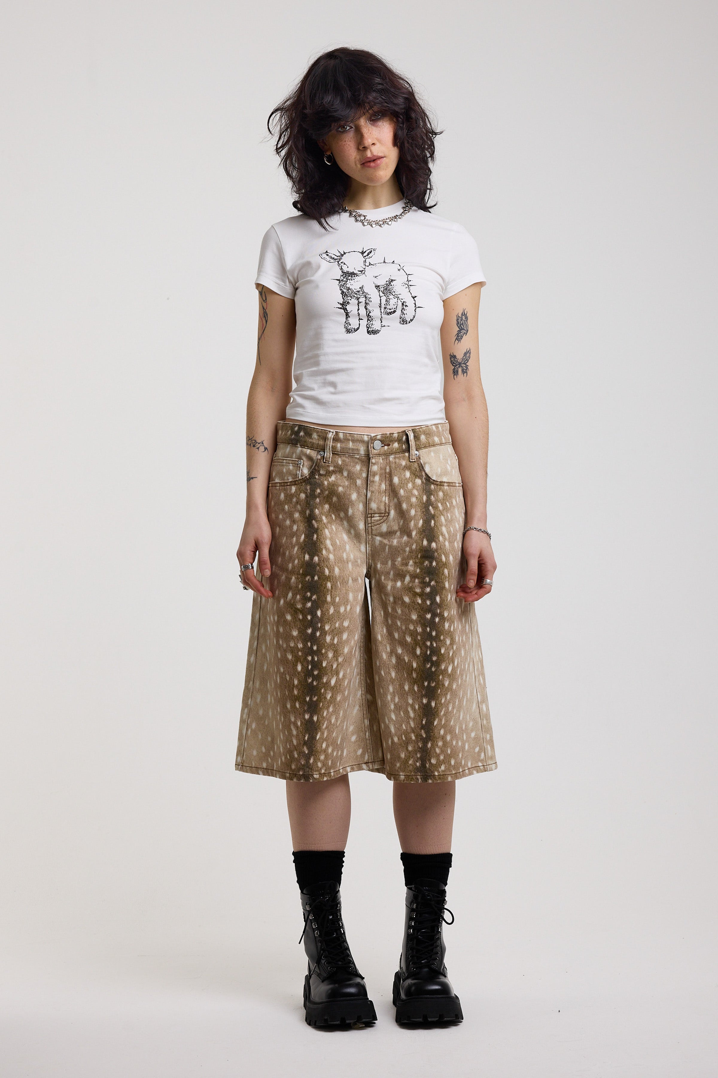 Baggy wide leg denim jorts in all over deer print, worn by model