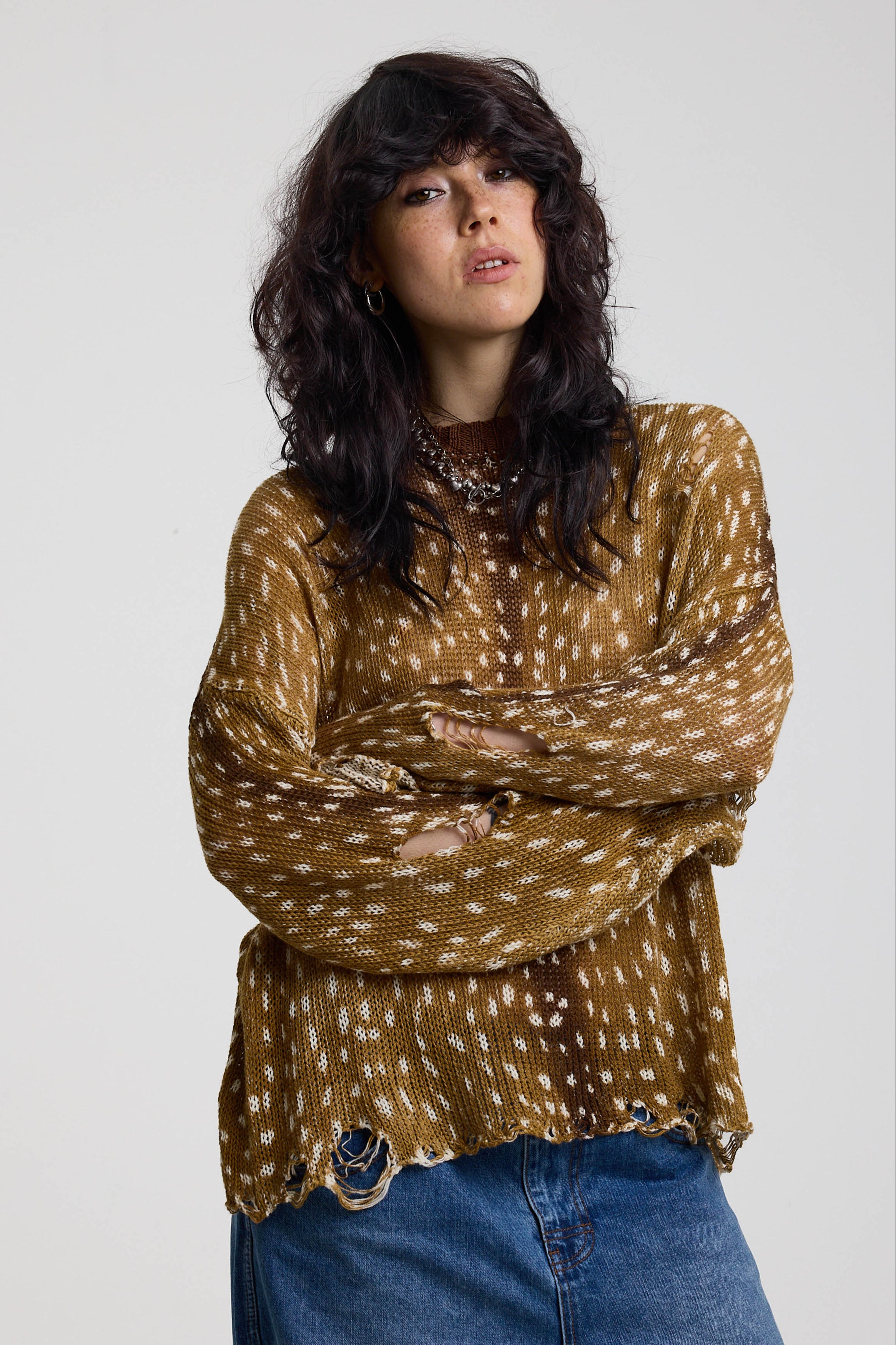 Brown deer print oversized knit jumper with grunge distressed details, worn by model