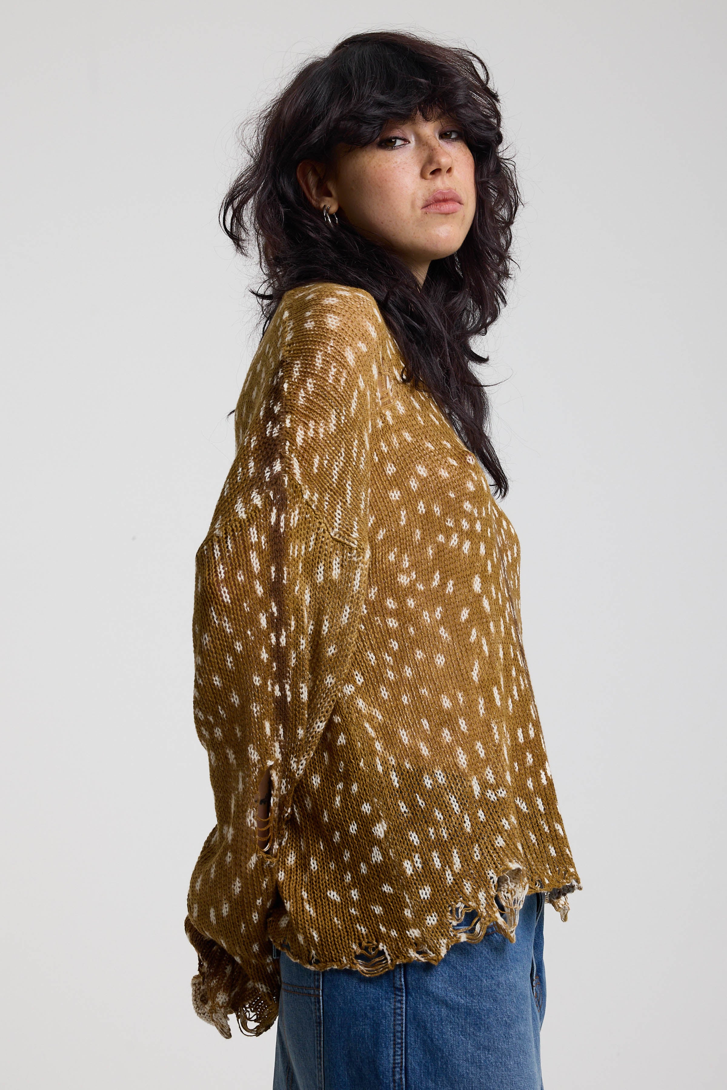Brown deer print oversized knit jumper with grunge distressed details, worn by model