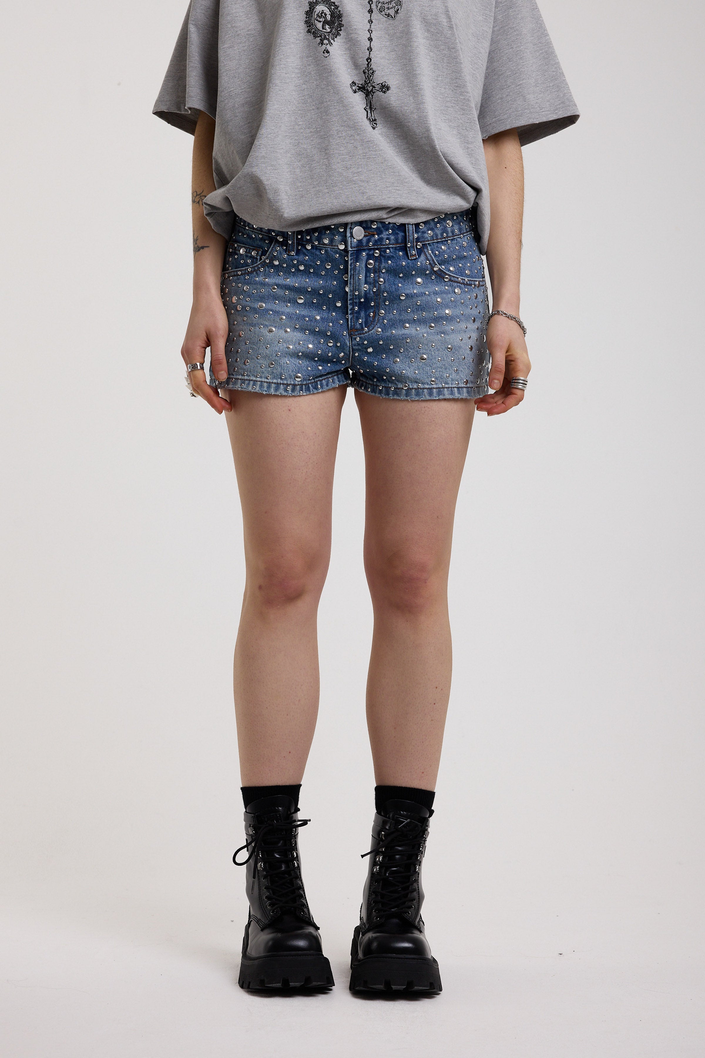 Light wash denim hotpants with all over hot fix silver studs, worn by model