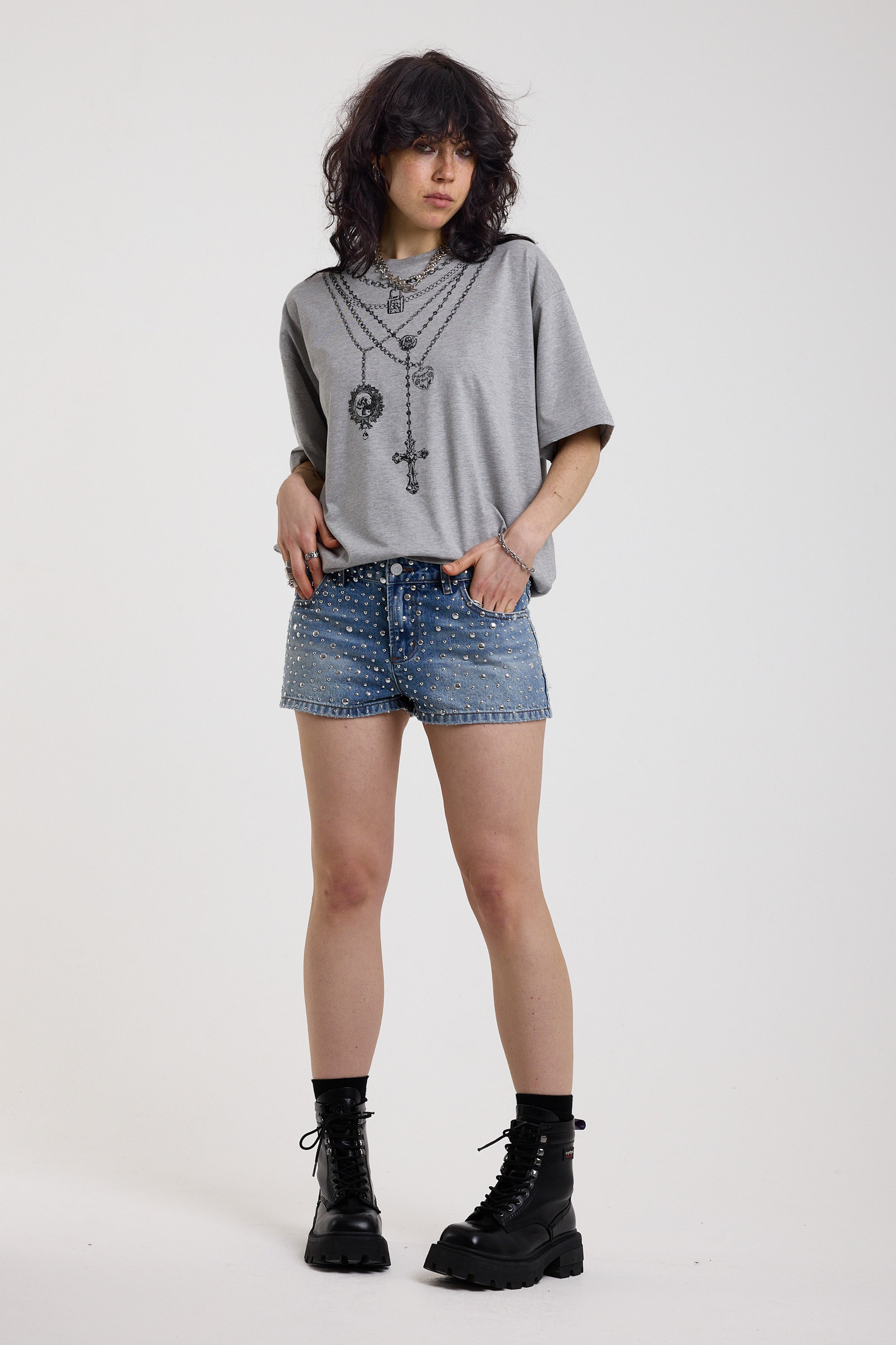 Light wash denim hotpants with all over hot fix silver studs, worn by model
