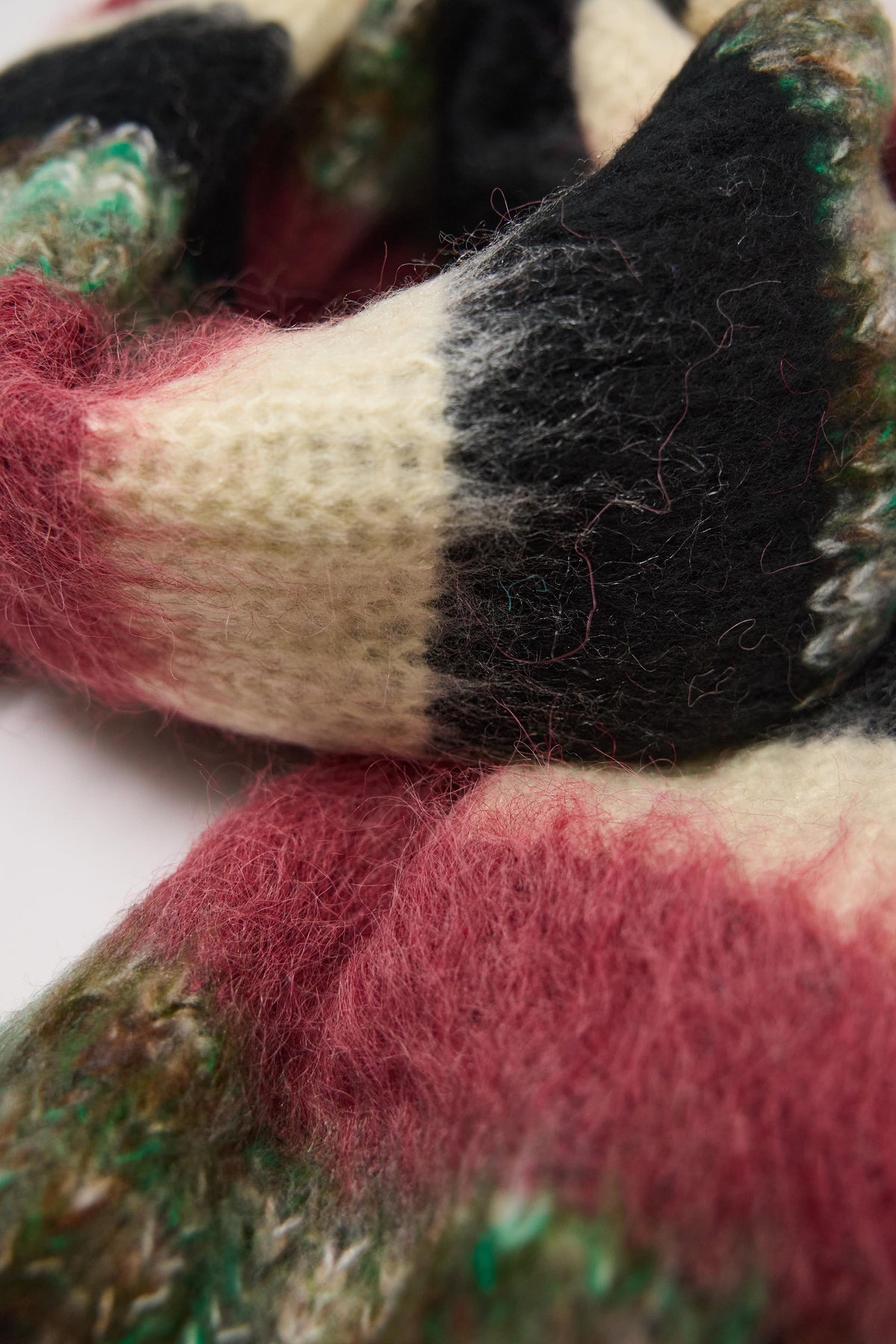 Mixed black, cream, pink and green stripe textured knit oversized blanket scarf, worn by model.