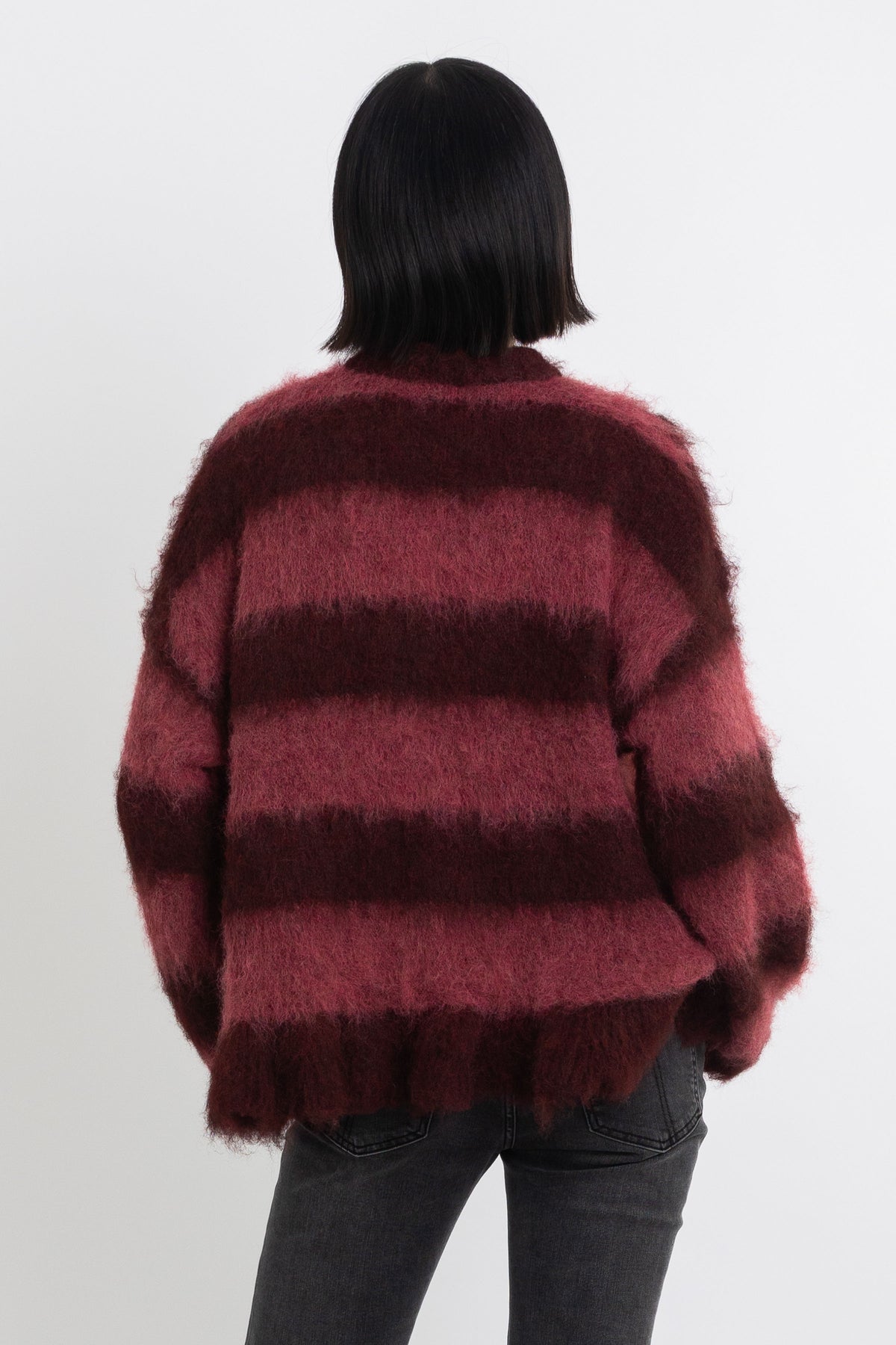 Bugundy and dusty stripe fuzzy knit cardigan with peplum hem, worn by model