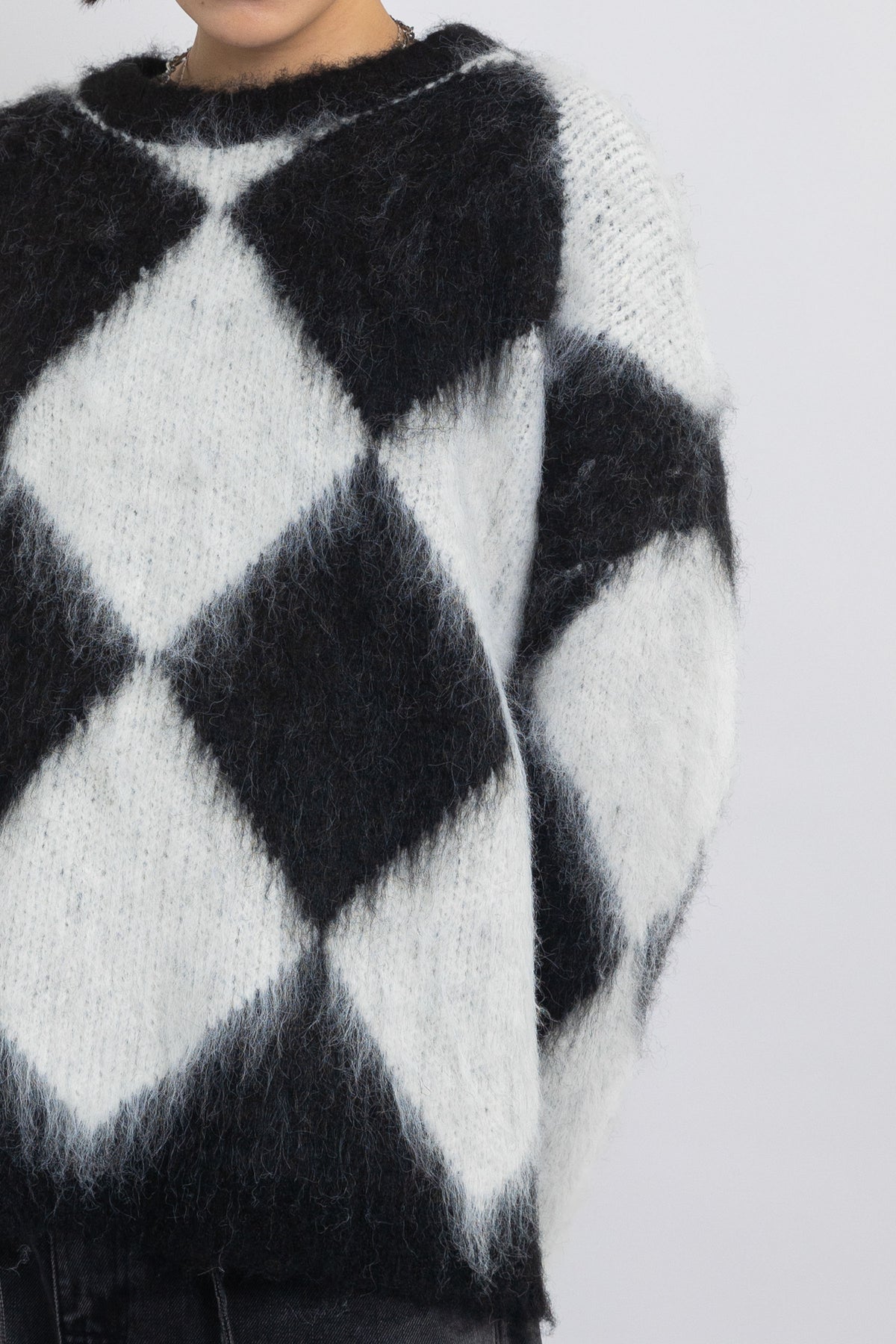 Black and white diamond argyle check fluffy knit oversized jumper, worn by model