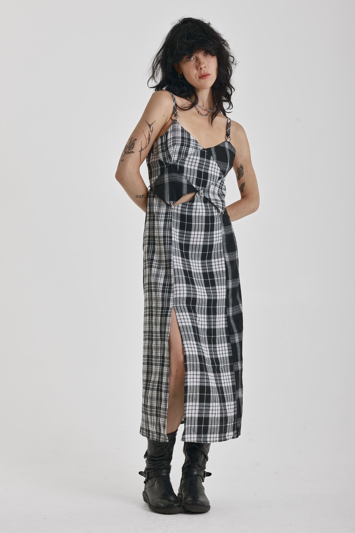 Black and white mixed check midi dress with cut-out panels and thigh split, worn by model