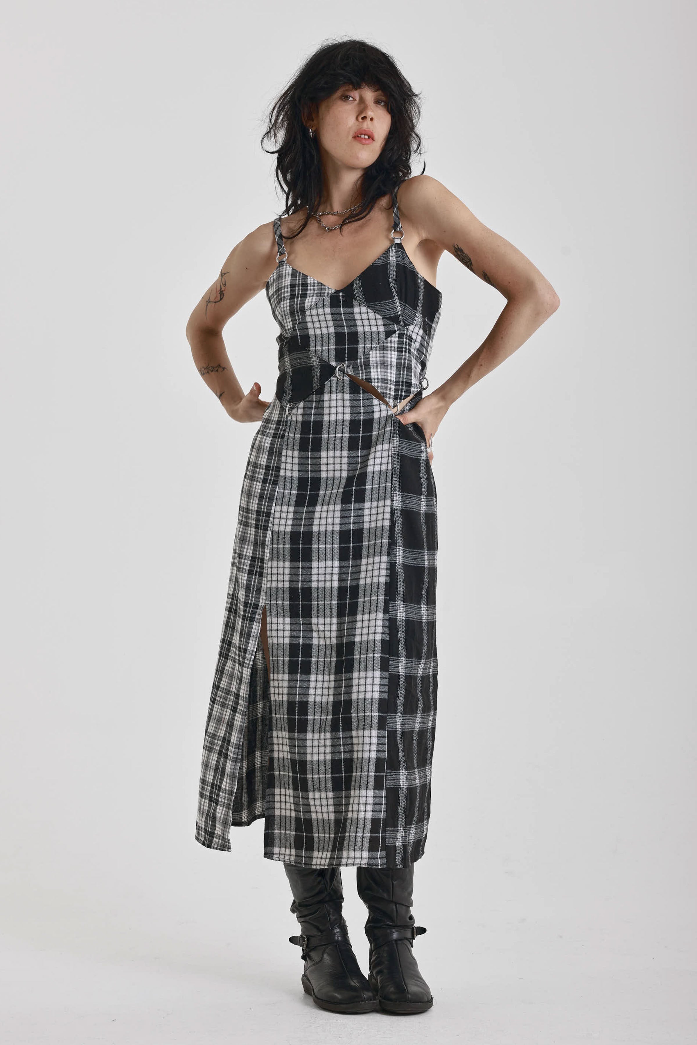Black and white mixed check midi dress with cut-out panels and thigh split, worn by model