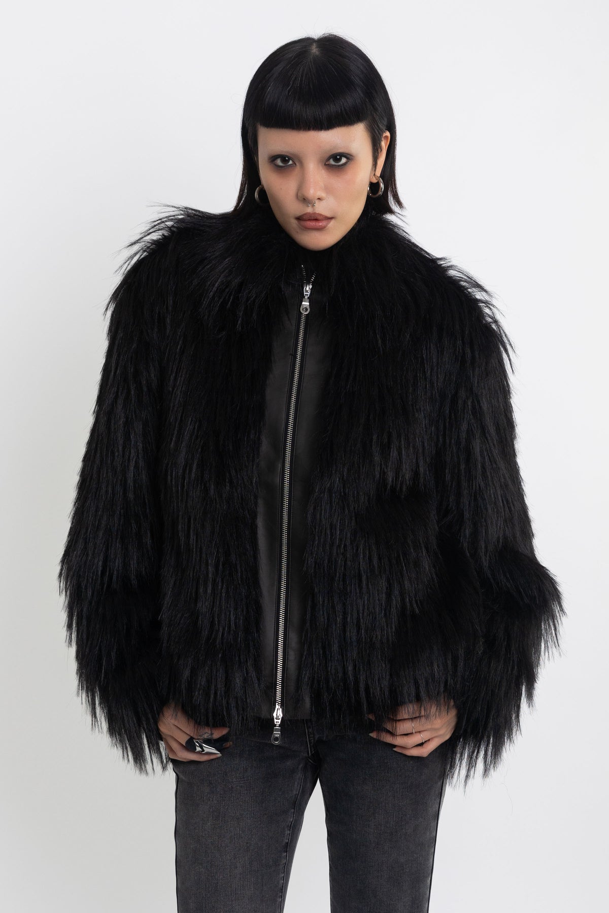 Black shaggy faux fur jacket with pu faux leather panel, worn by model