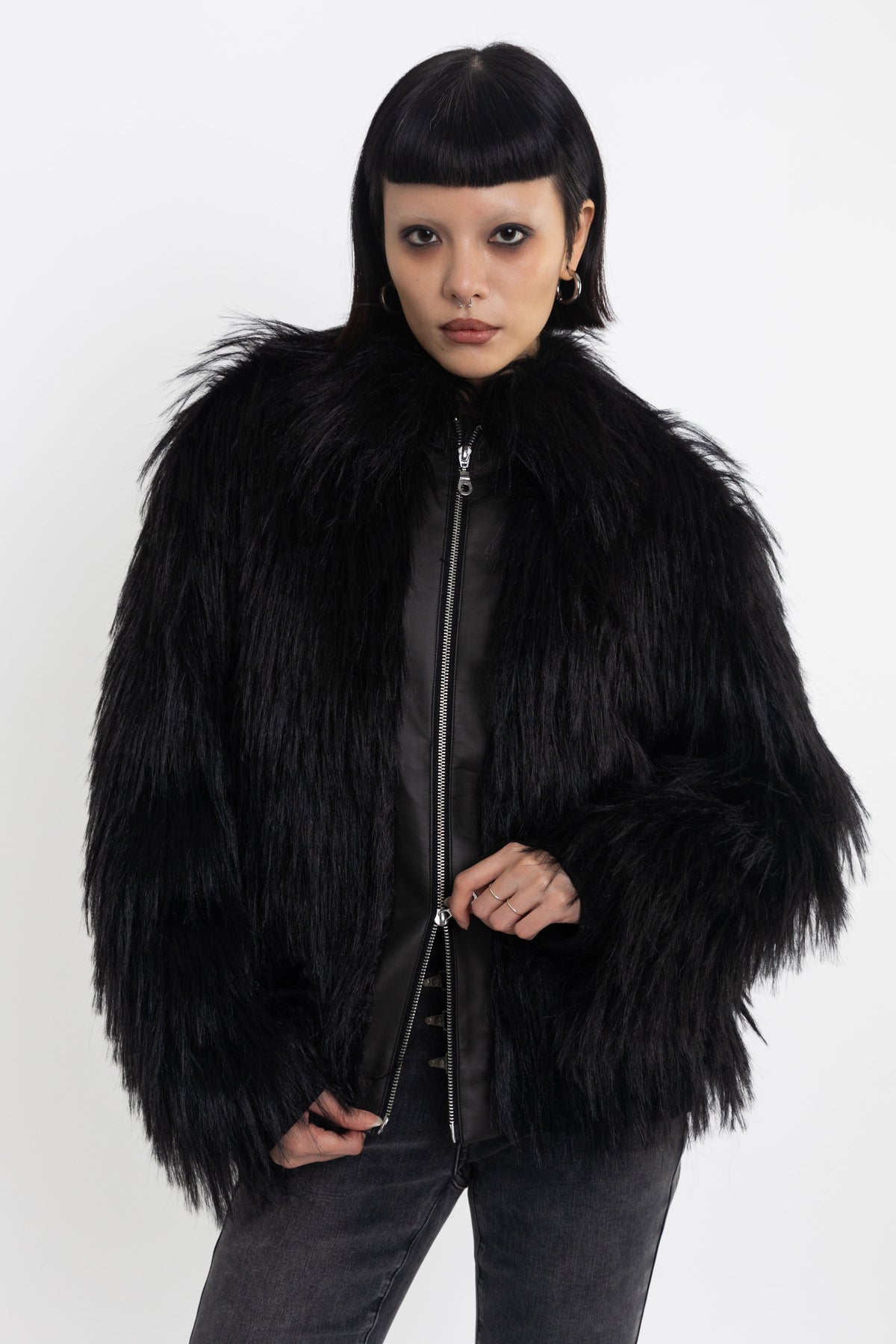 Black shaggy faux fur jacket with pu faux leather panel, worn by model