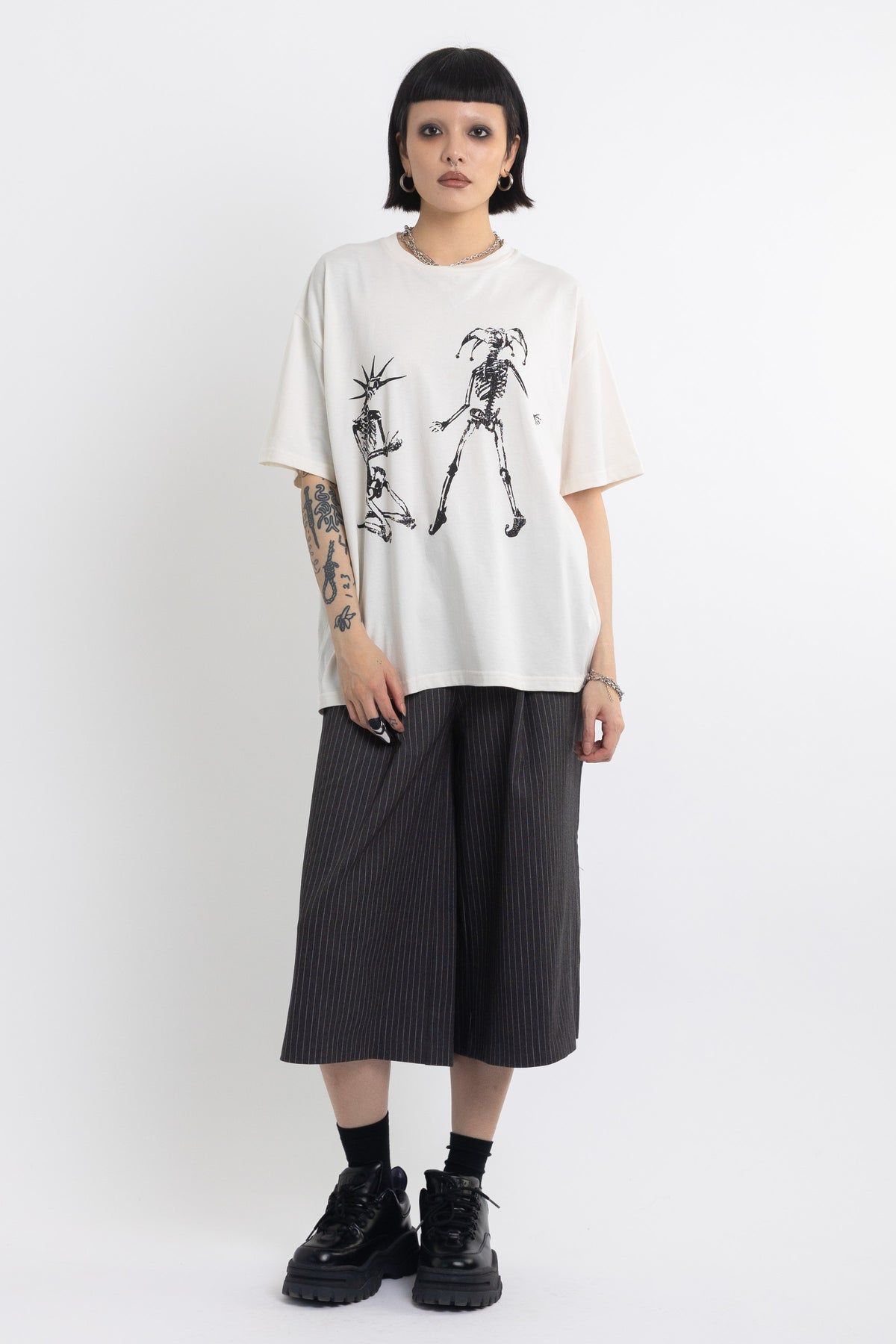 Vintage wash oversized graphic t-shirt with skeleton print, worn by model