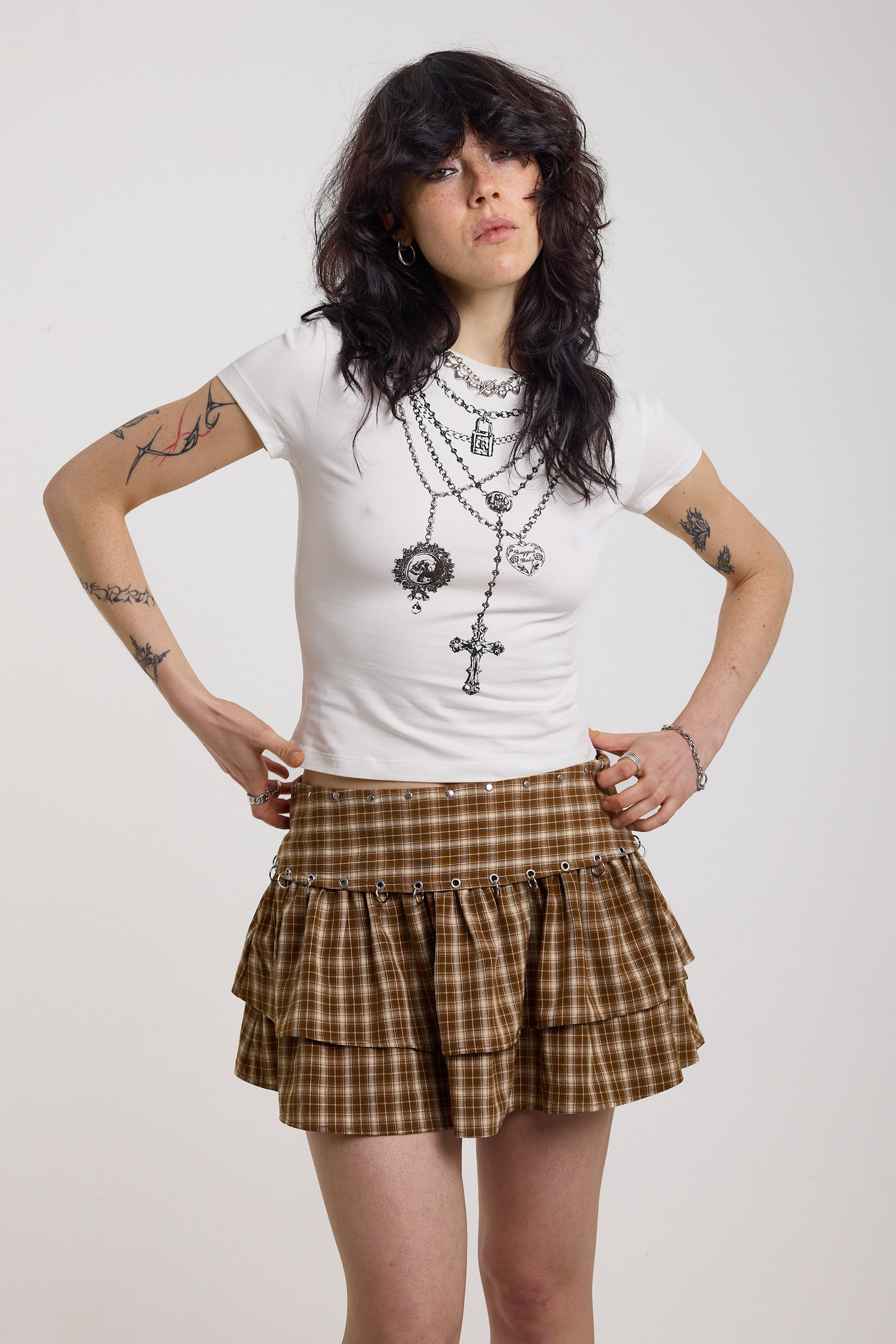 White shrunken baby t-shirt with rosary pendant cross necklace graphic, worn by a model