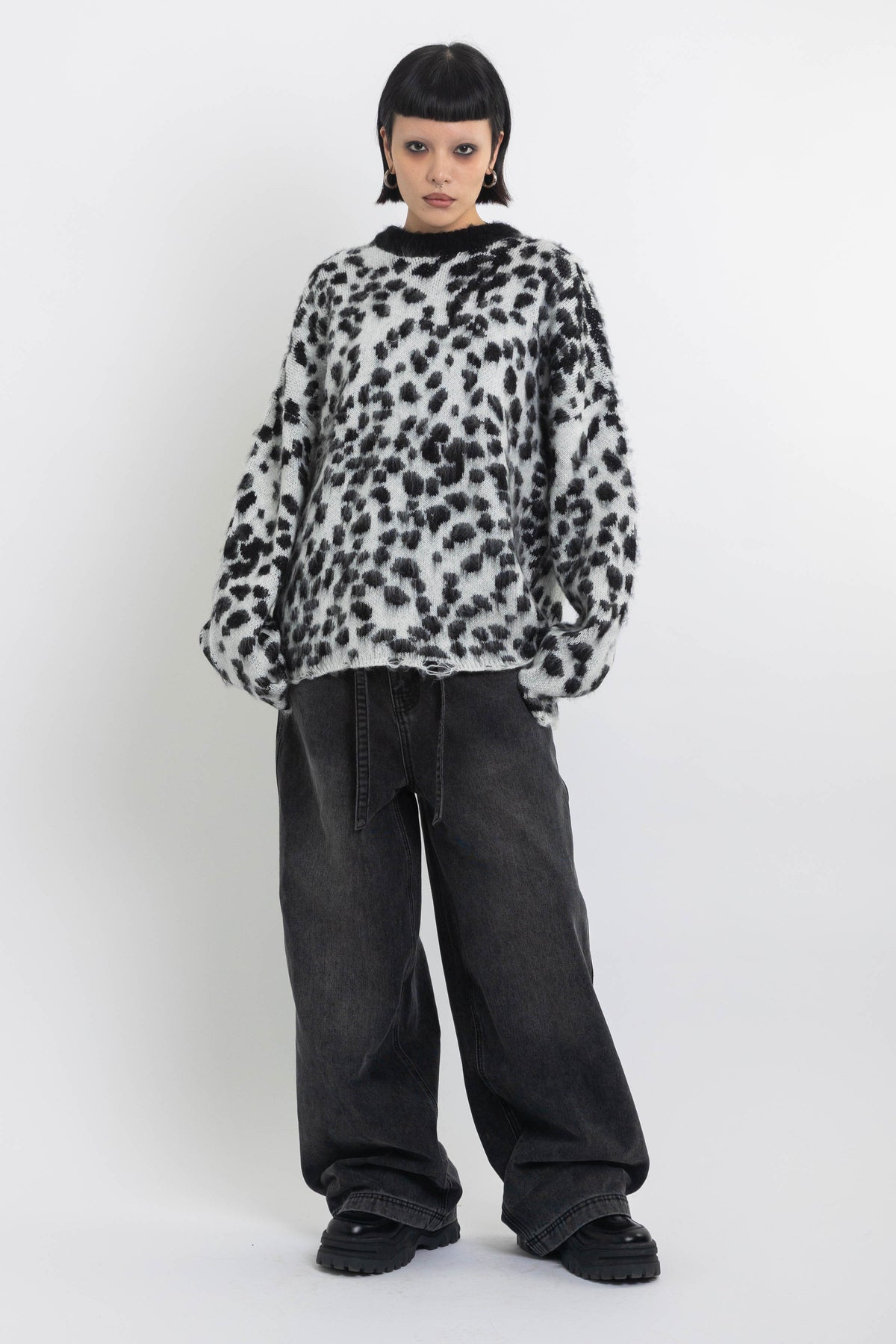 Black and white dalmatian print oversized fuzzy knit jumper, worn by model