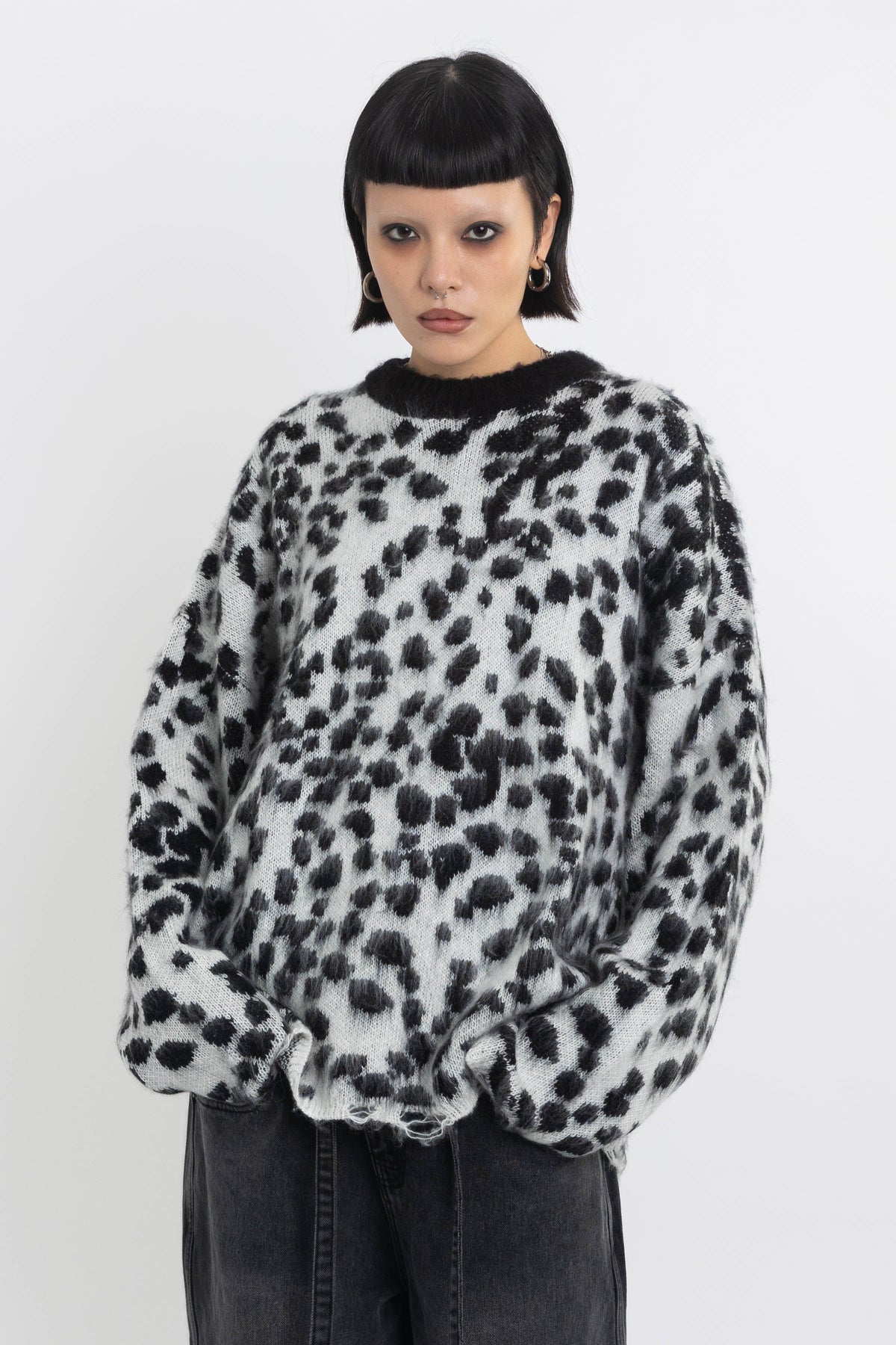 Black and white dalmatian print oversized fuzzy knit jumper, worn by model