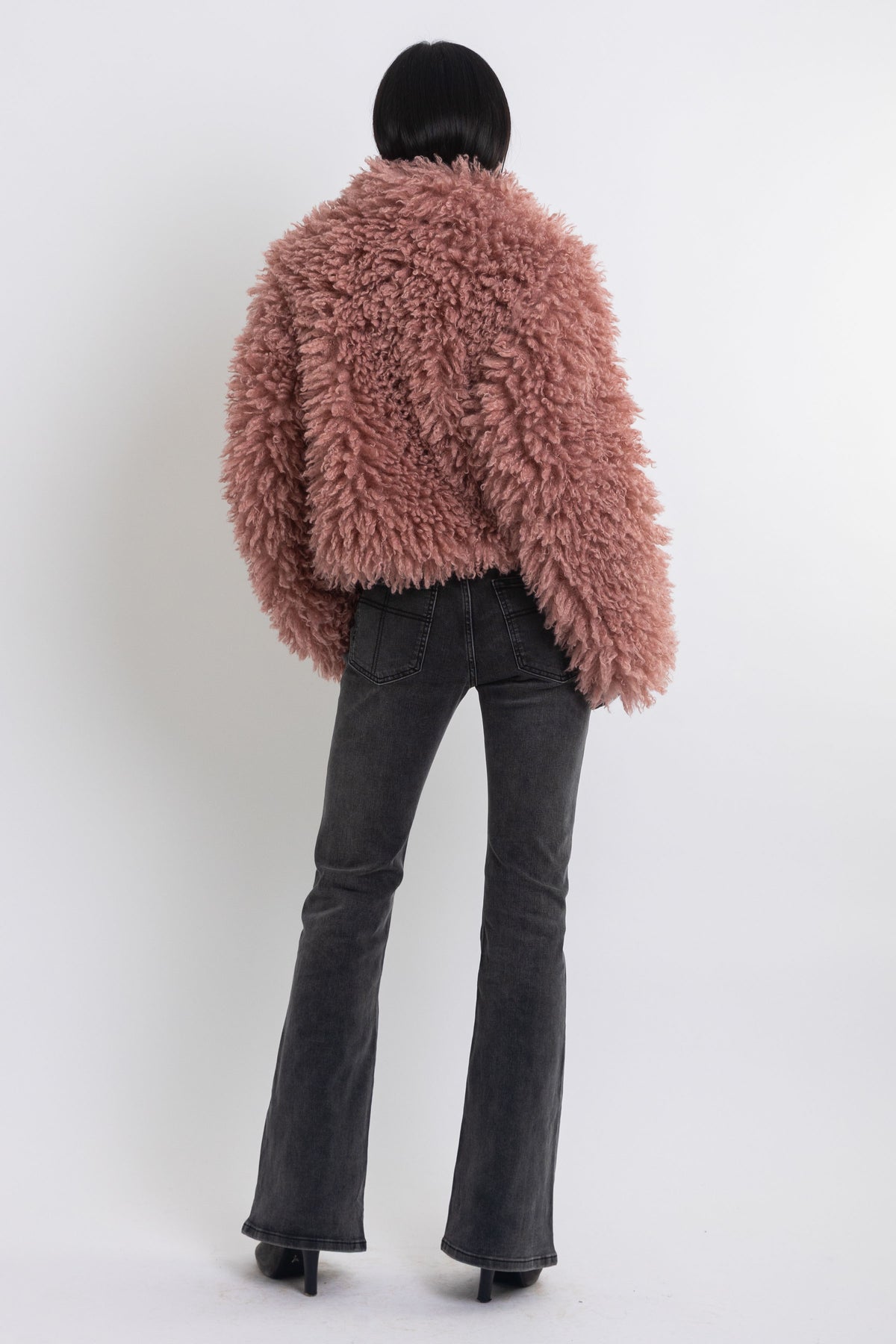 Dusty pink shaggy faux fur jacket with oversized collar and 2-way zip closure, worn by model