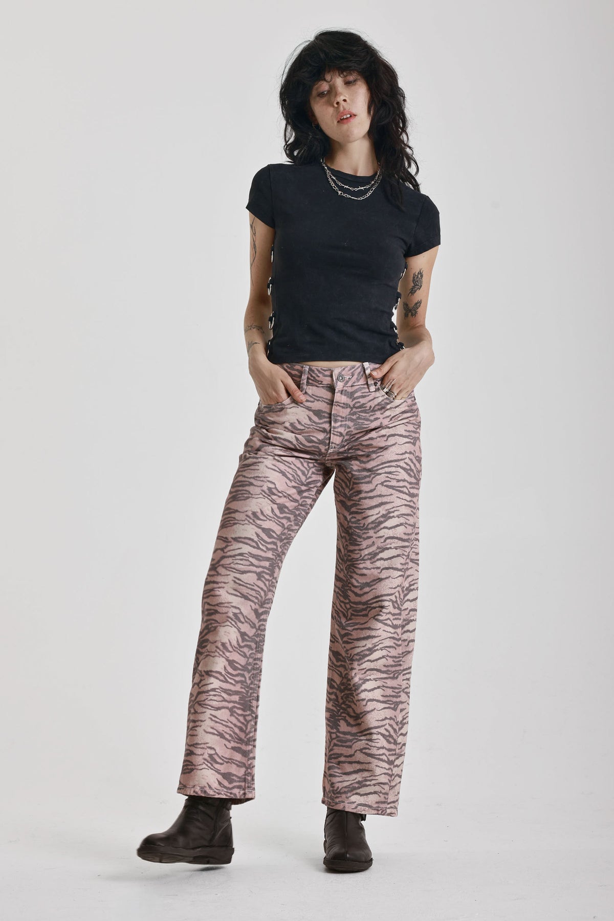 Brown tiger print relaxed straight leg jeans, worn by model