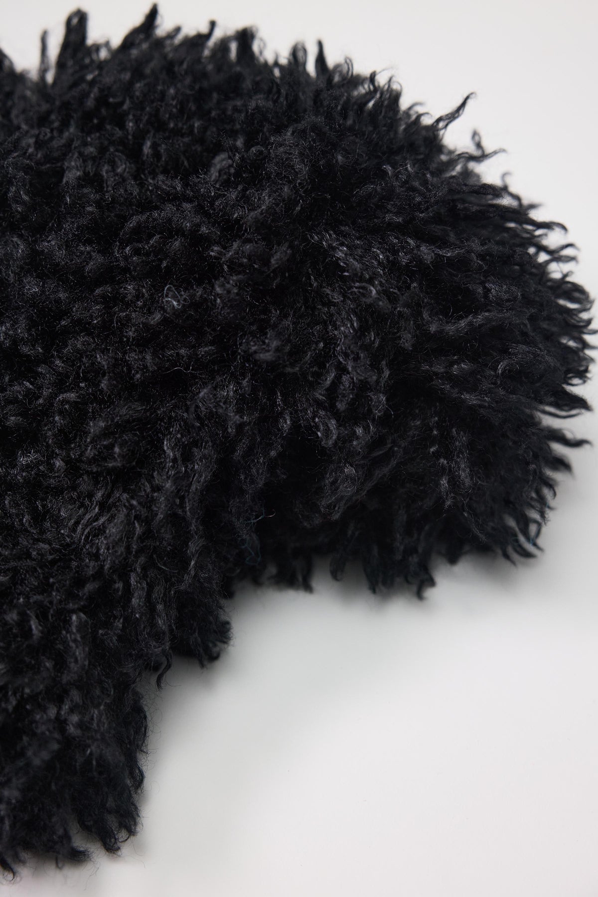Black shaggy faux fur trapper hat with pom poms