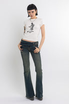 Off white baby t-shirt with praying skeleton graphic print, worn by model