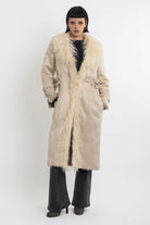 Ecru faux suede and shearling longline afghan penny lane coat with silver eyelet buckles. worn by model 