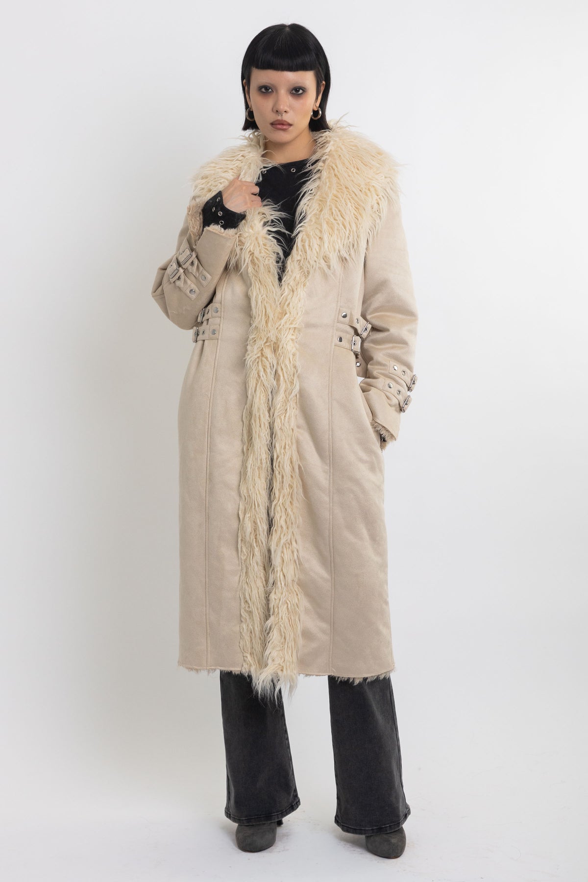 Ecru faux suede and shearling longline afghan penny lane coat with silver eyelet buckles. worn by model 
