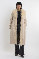 Ecru faux suede and shearling longline afghan penny lane coat with silver eyelet buckles. worn by model 