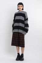 Black and grey mixed cable knit oversized jumper, worn by model