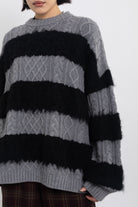 Black and grey mixed cable knit oversized jumper, worn by model