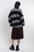 Black and grey mixed cable knit oversized jumper, worn by model