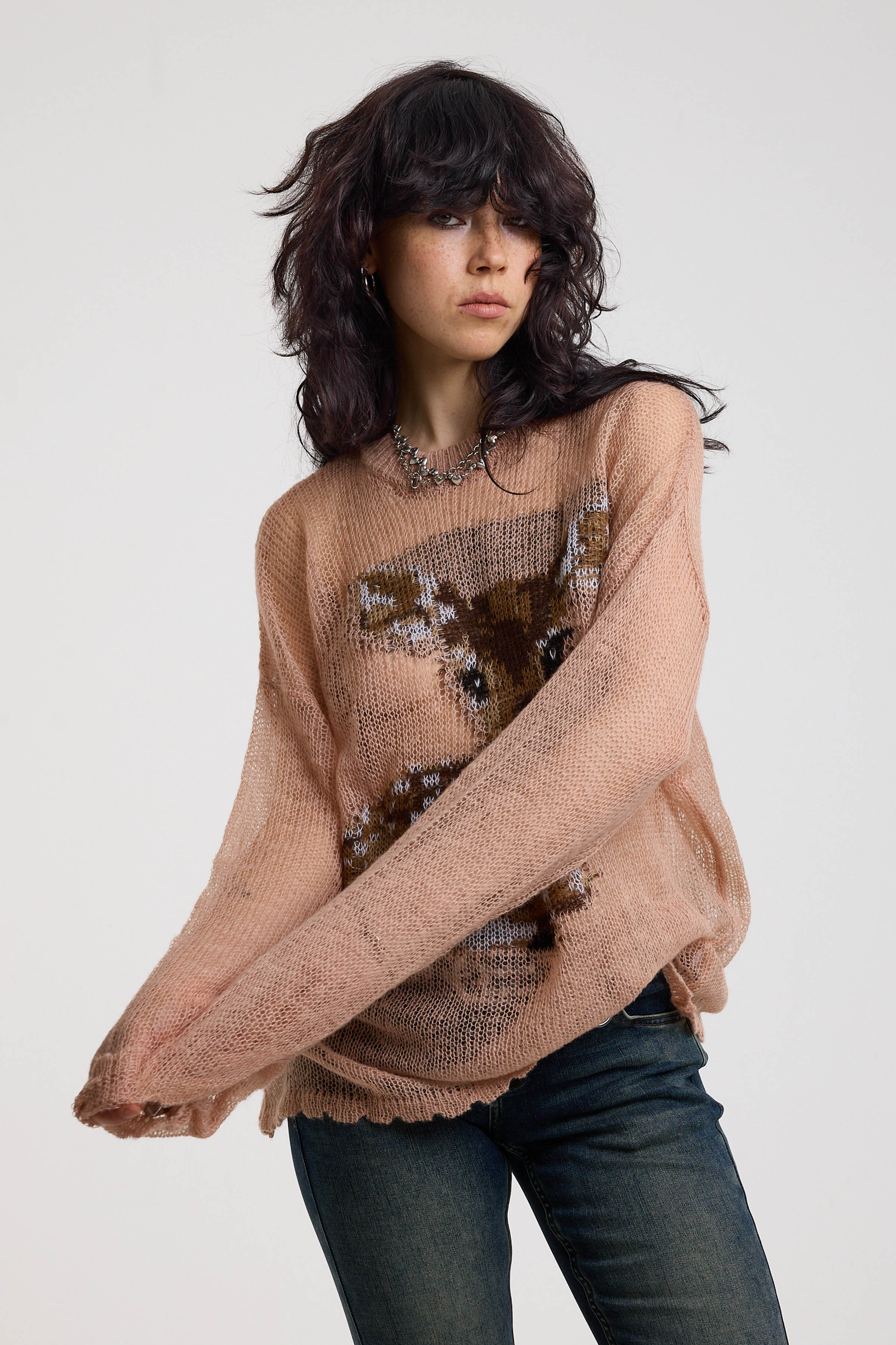 Dusty pink oversized sheer open knit jumper with deer graphic, worn by model