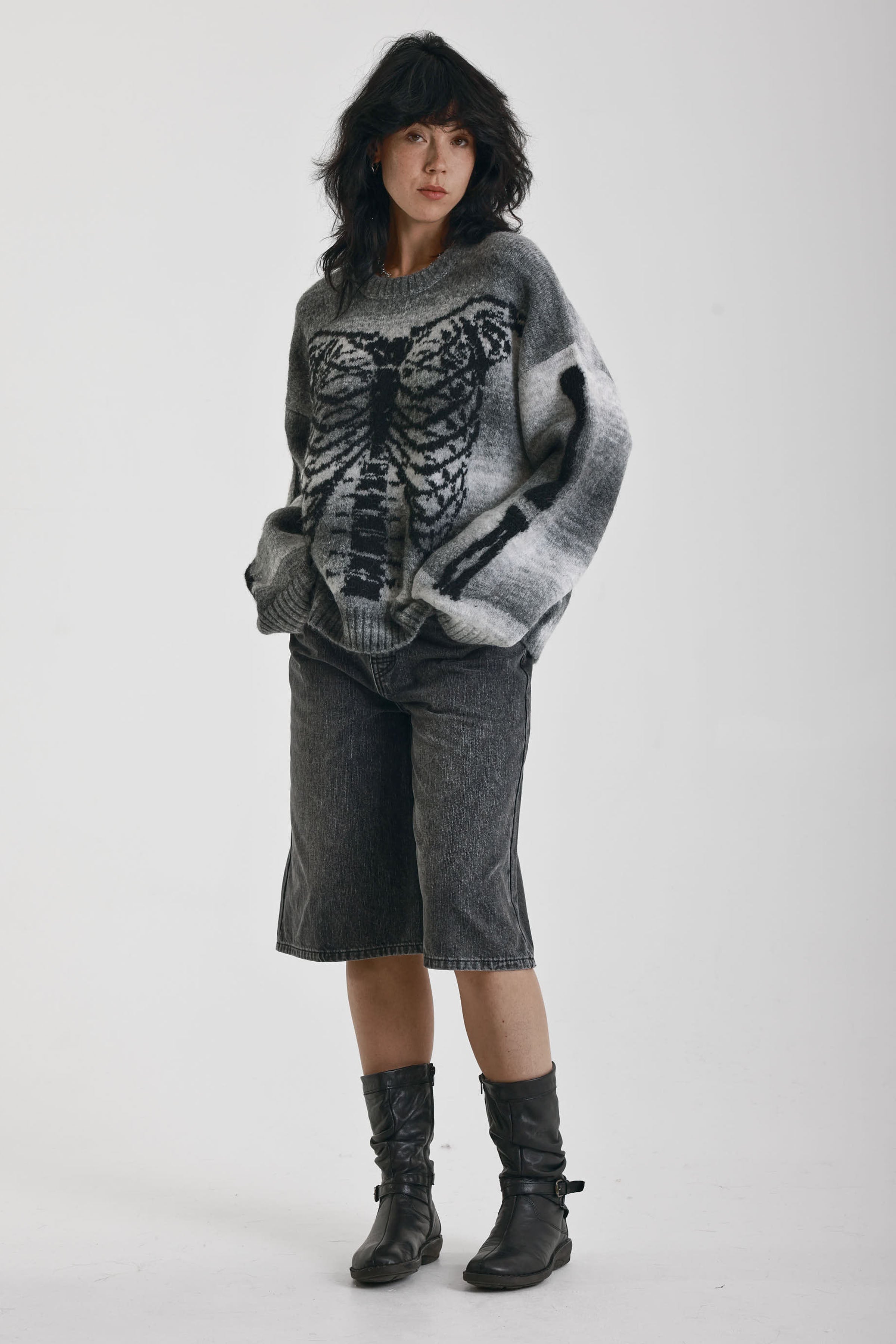 Grey spacedye stripe oversized knit jumper with skeleton ribcage graphic, worn by model