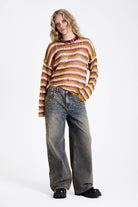 Pink and green contrast stripe crochet open knit oversized jumper, worn by model