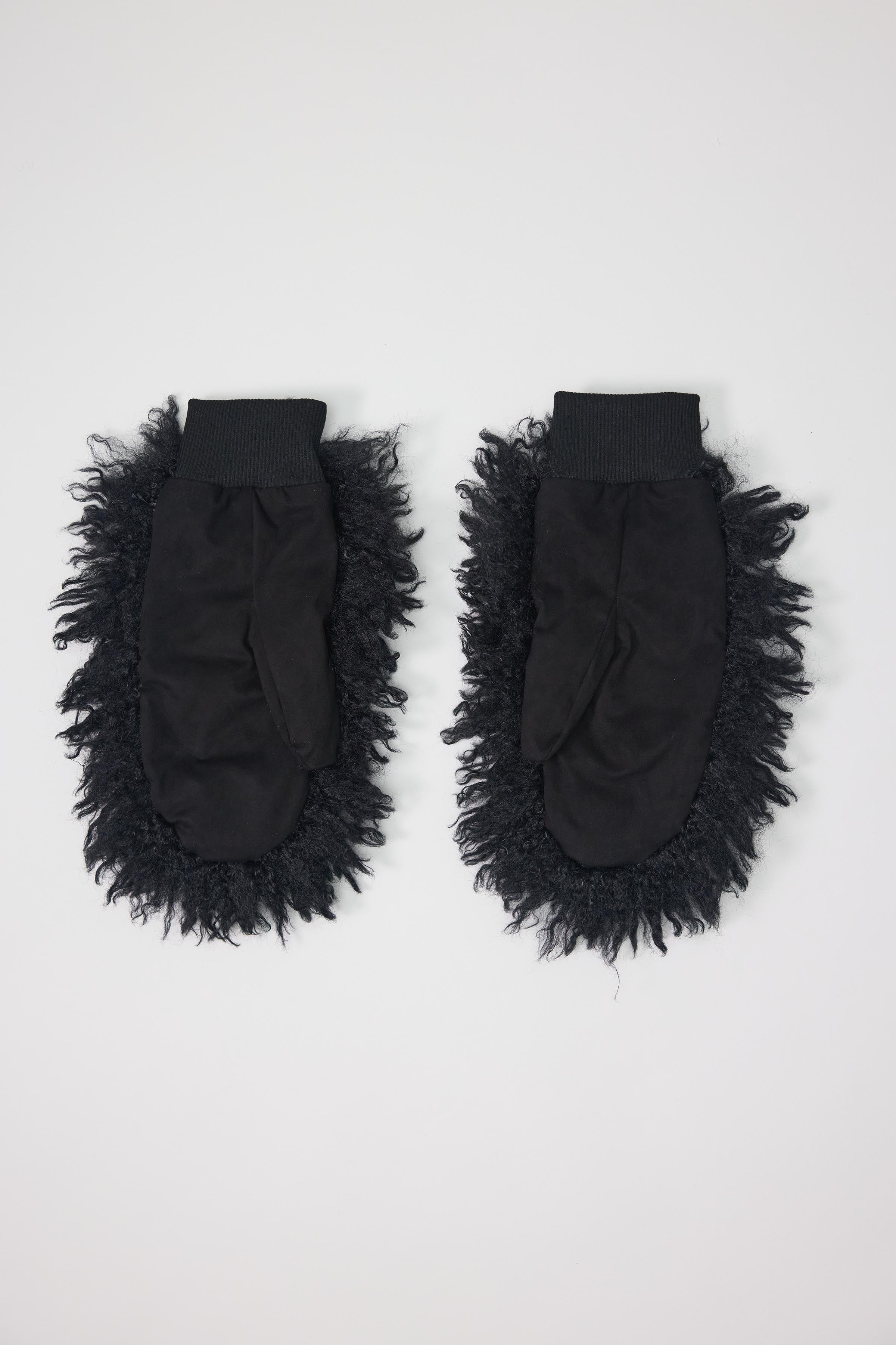Black shaggy faux fur mittens.