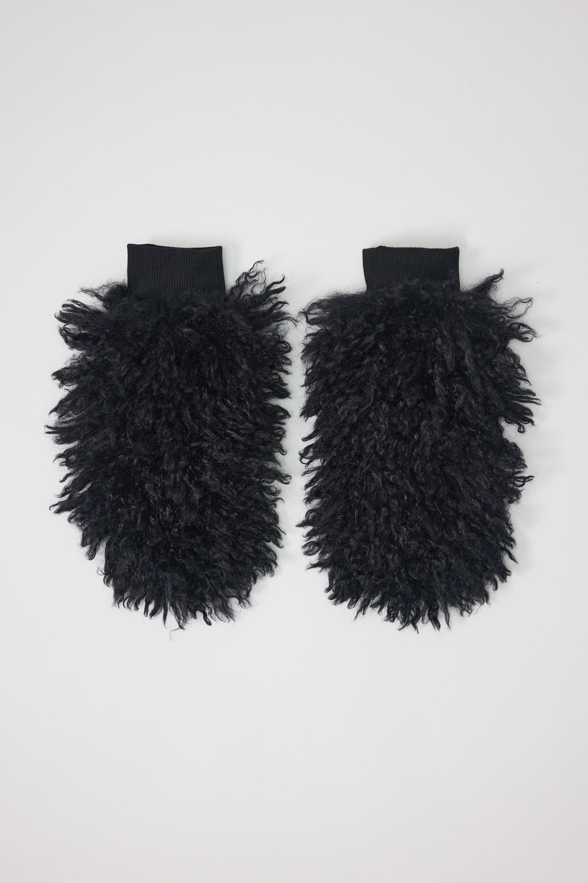 Black shaggy faux fur mittens.