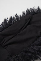 Black shaggy faux fur mittens.