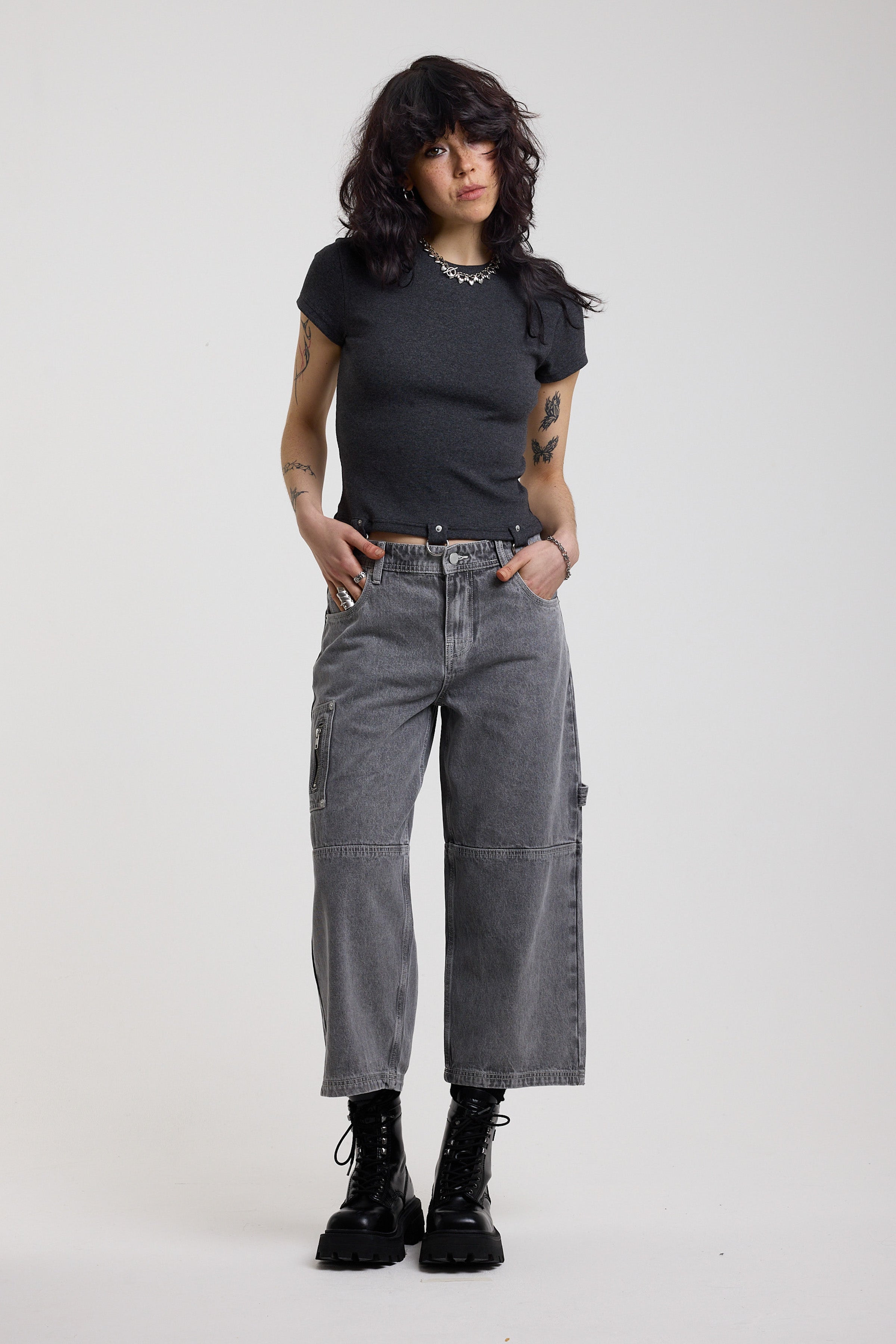 Charcoal ribbed crop t-shirt with silver D-ring hardware detail, worn by model