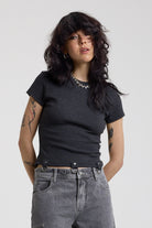 Charcoal ribbed crop t-shirt with silver D-ring hardware detail, worn by model
