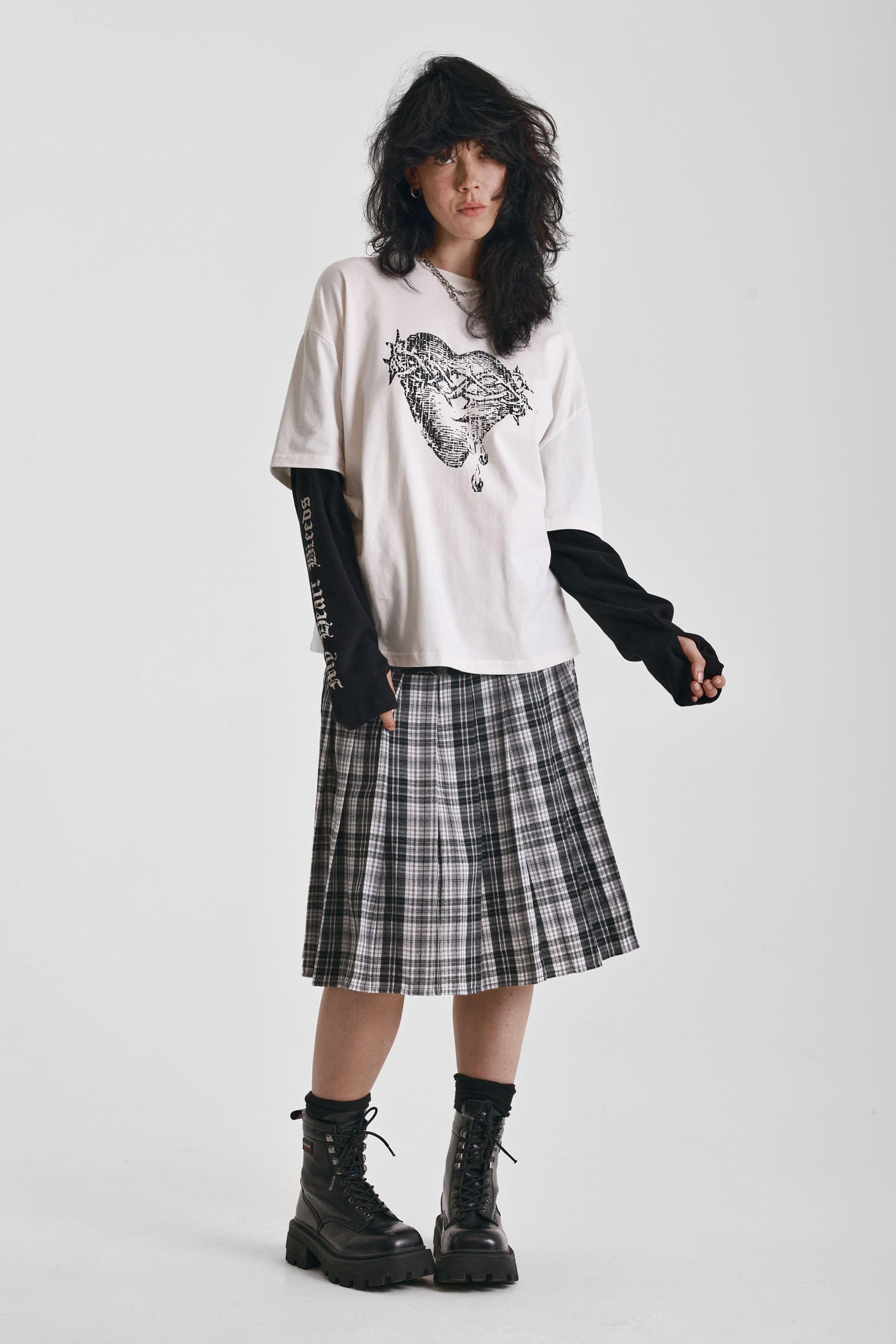 Ecru long sleeve skate t-shirt with screen printed grunge thorn heart print, worn by model