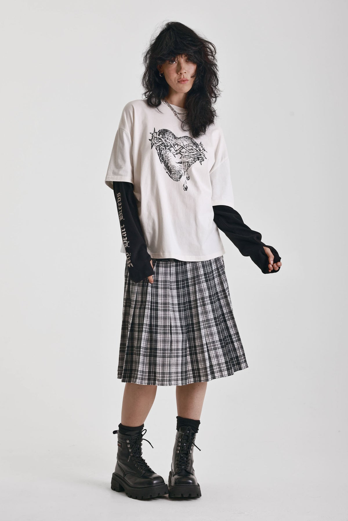 Ecru long sleeve skate t-shirt with screen printed grunge thorn heart print, worn by model