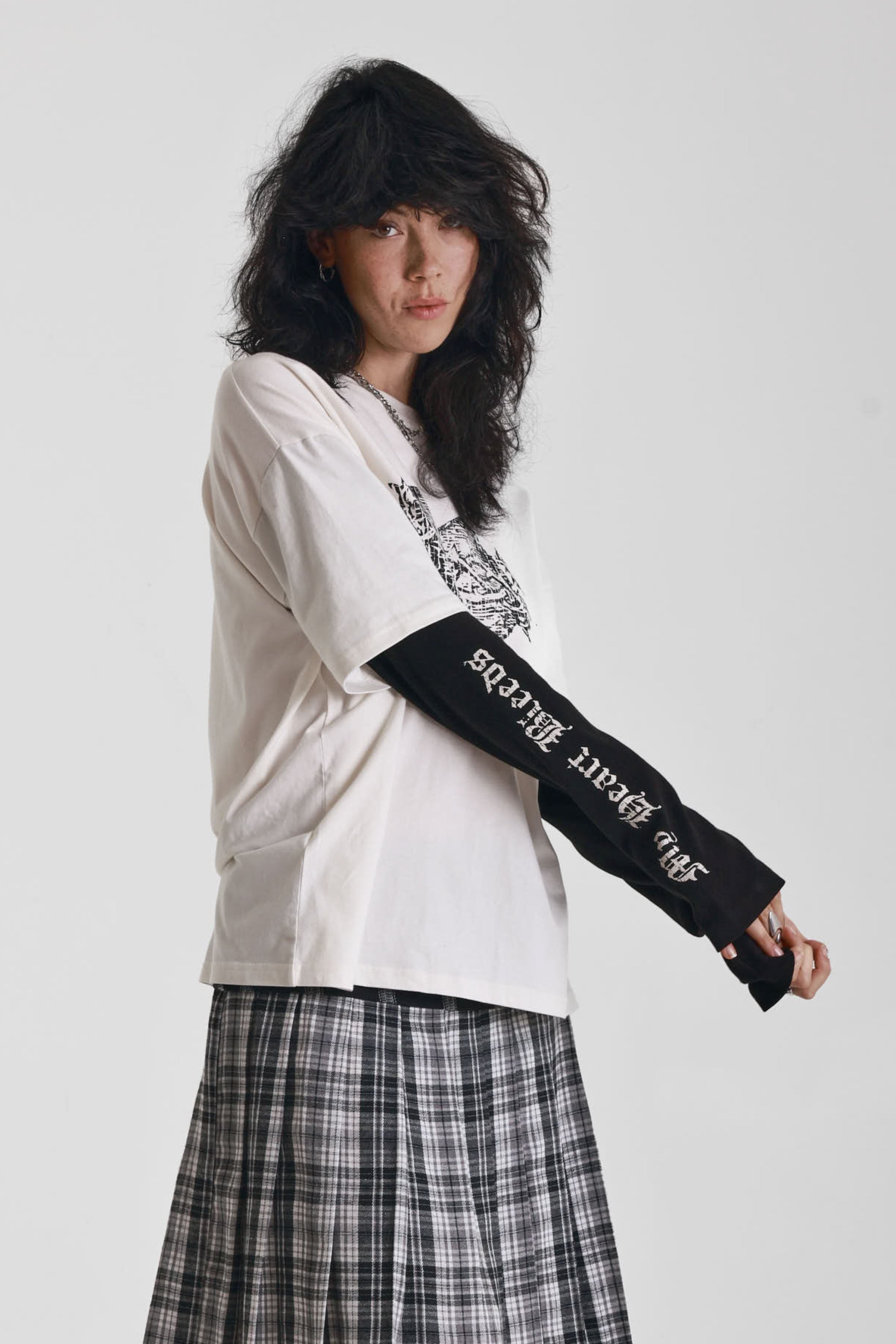 Ecru long sleeve skate t-shirt with screen printed grunge thorn heart print, worn by model