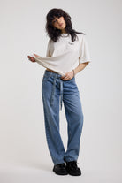 Blue baggy balloon boyfriend jeans with denim tie belt, worn by model
