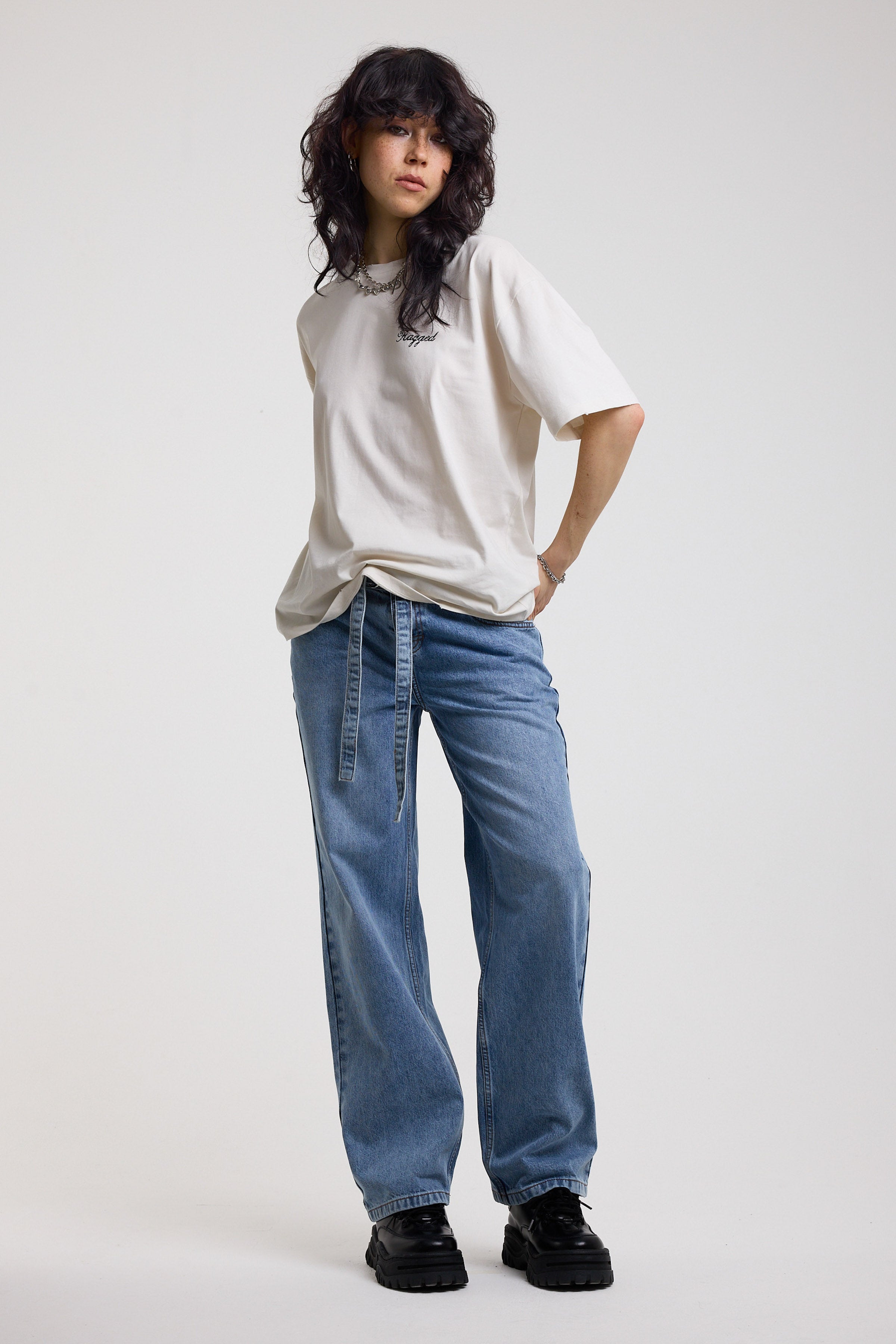 Blue baggy balloon boyfriend jeans with denim tie belt, worn by model