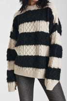 Black and white stripe textured cable knit oversized jumper, worn by model