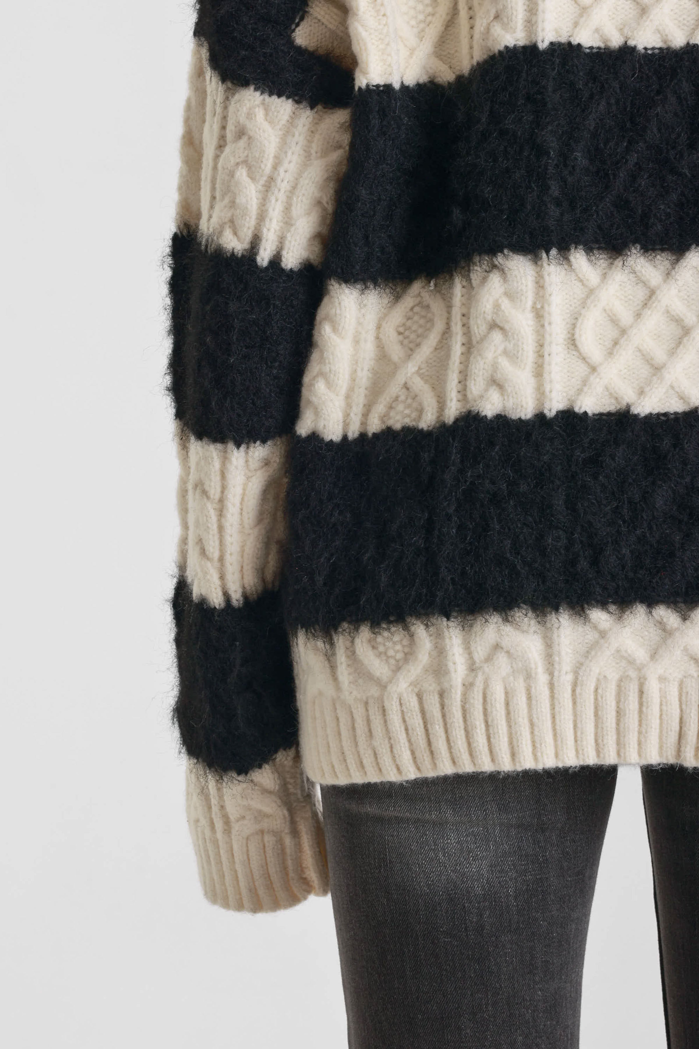 Black and white stripe textured cable knit oversized jumper, worn by model