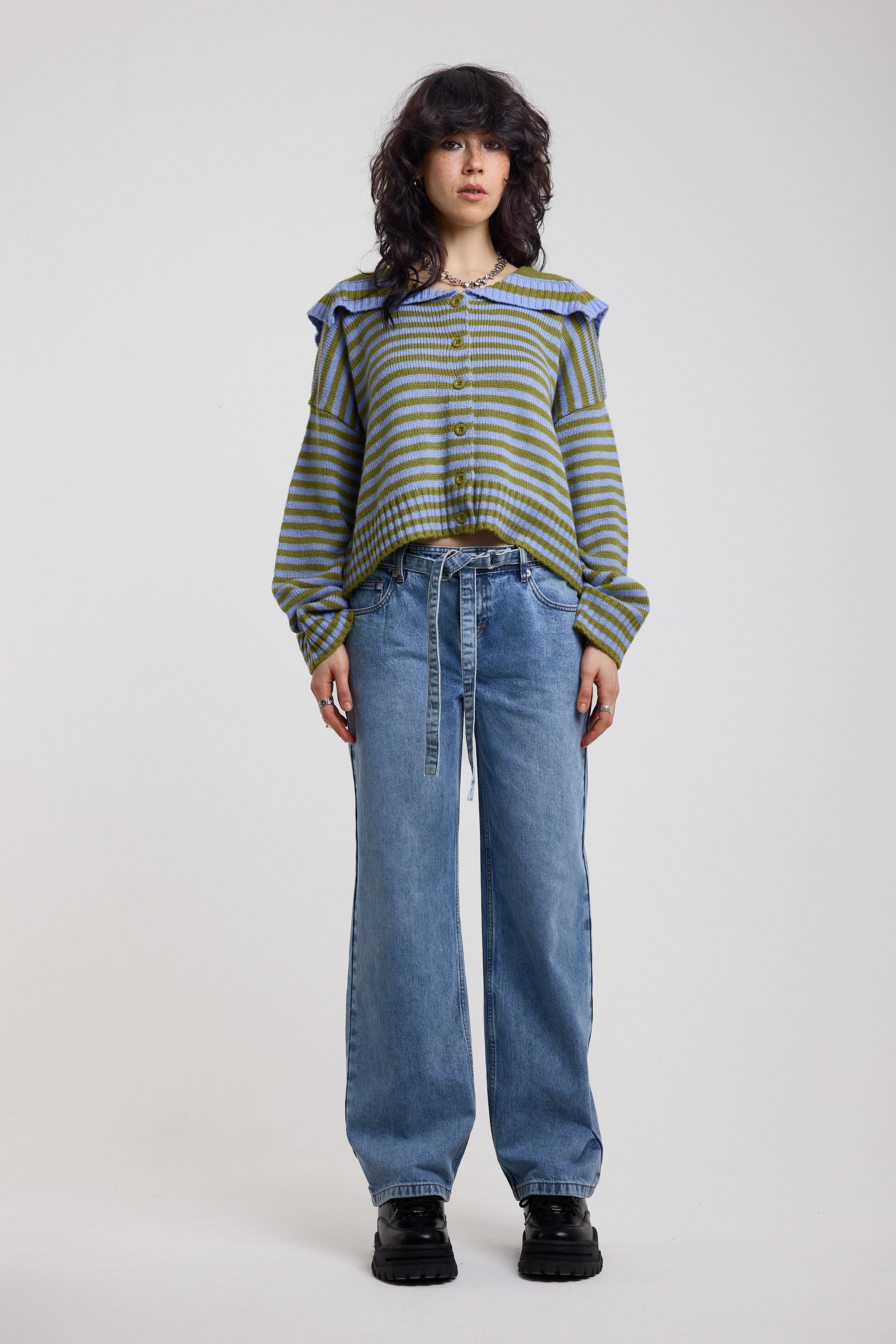 Blue and green stripe knit cardigan with oversized collar, worn by a model