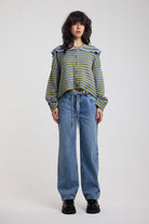 Blue and green stripe knit cardigan with oversized collar, worn by a model