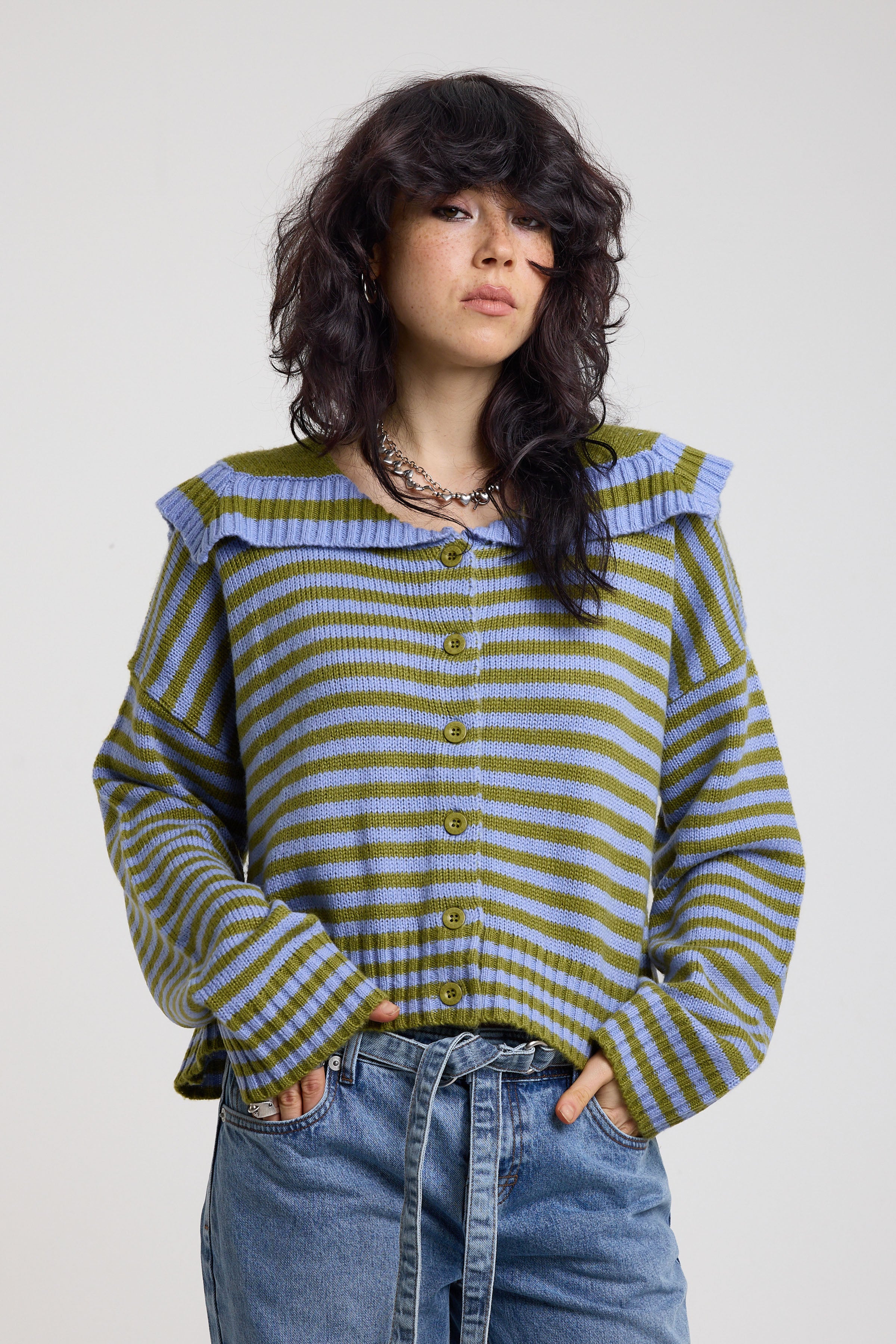 Blue and green stripe knit cardigan with oversized collar, worn by a model