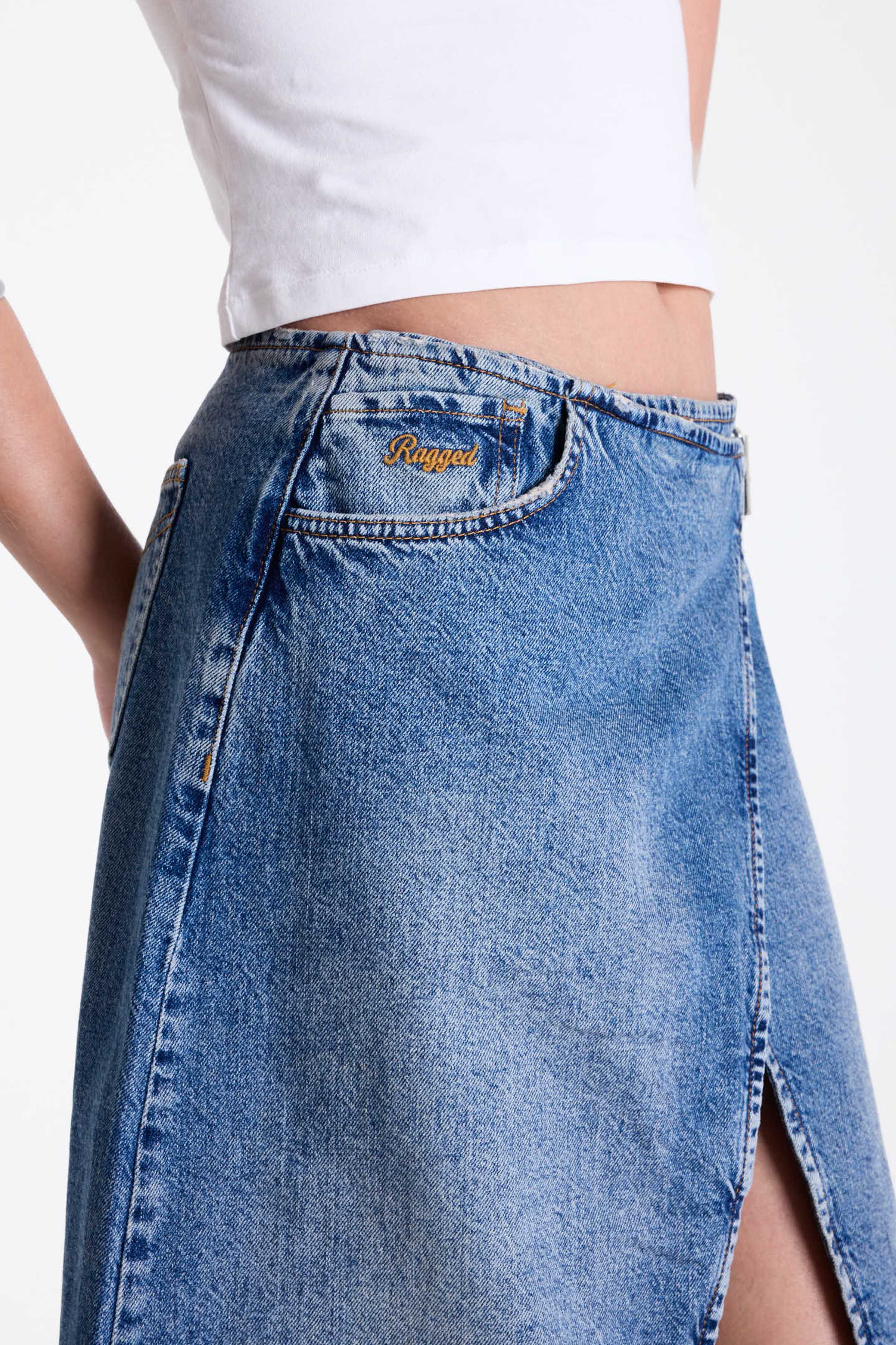Vintage wash denim maxi skirt with thigh high split and buckle belt fastening, worn by model.