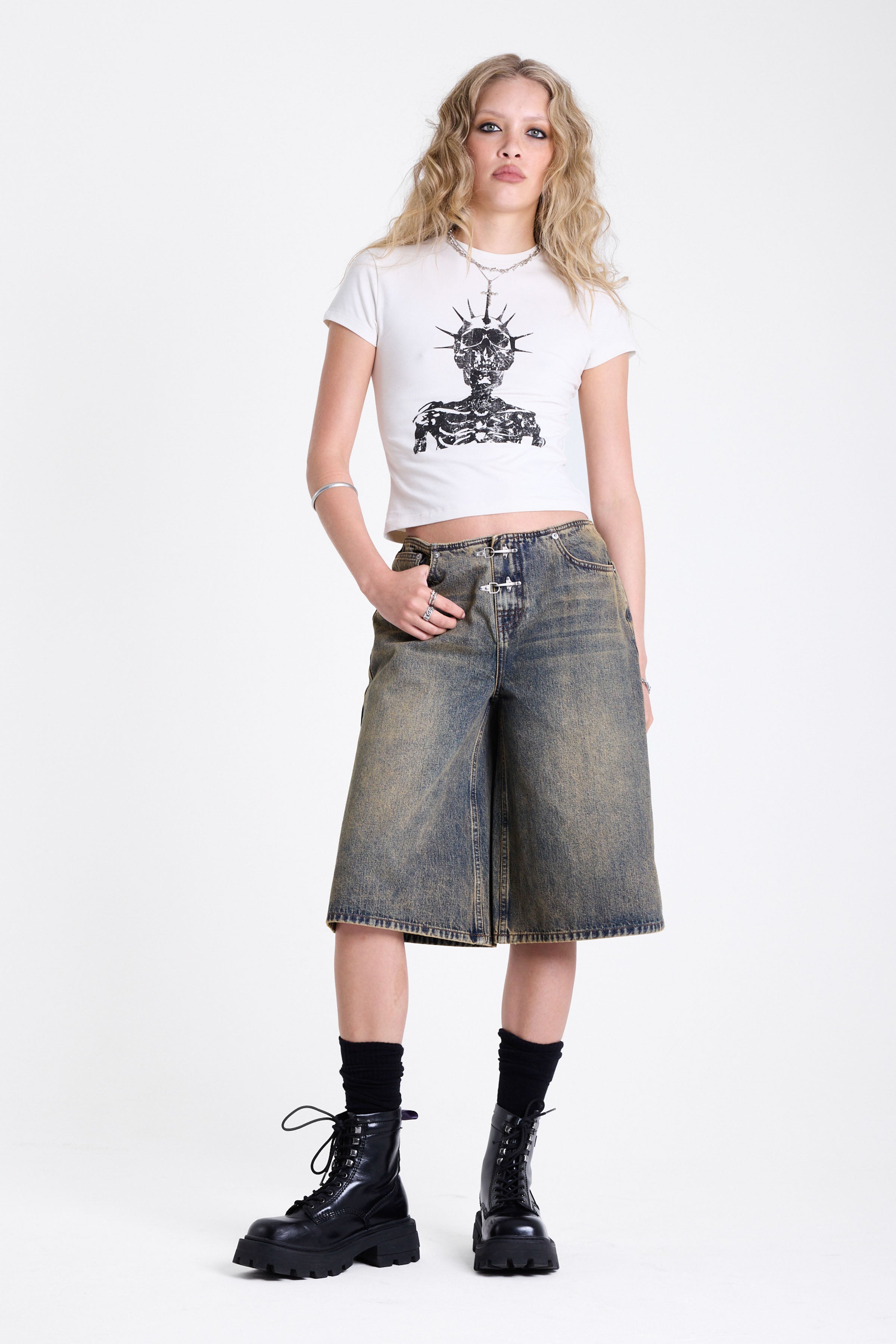Dirty wash longline oversized denim jorts with no waistband and silver latch clasp detail, worn by model