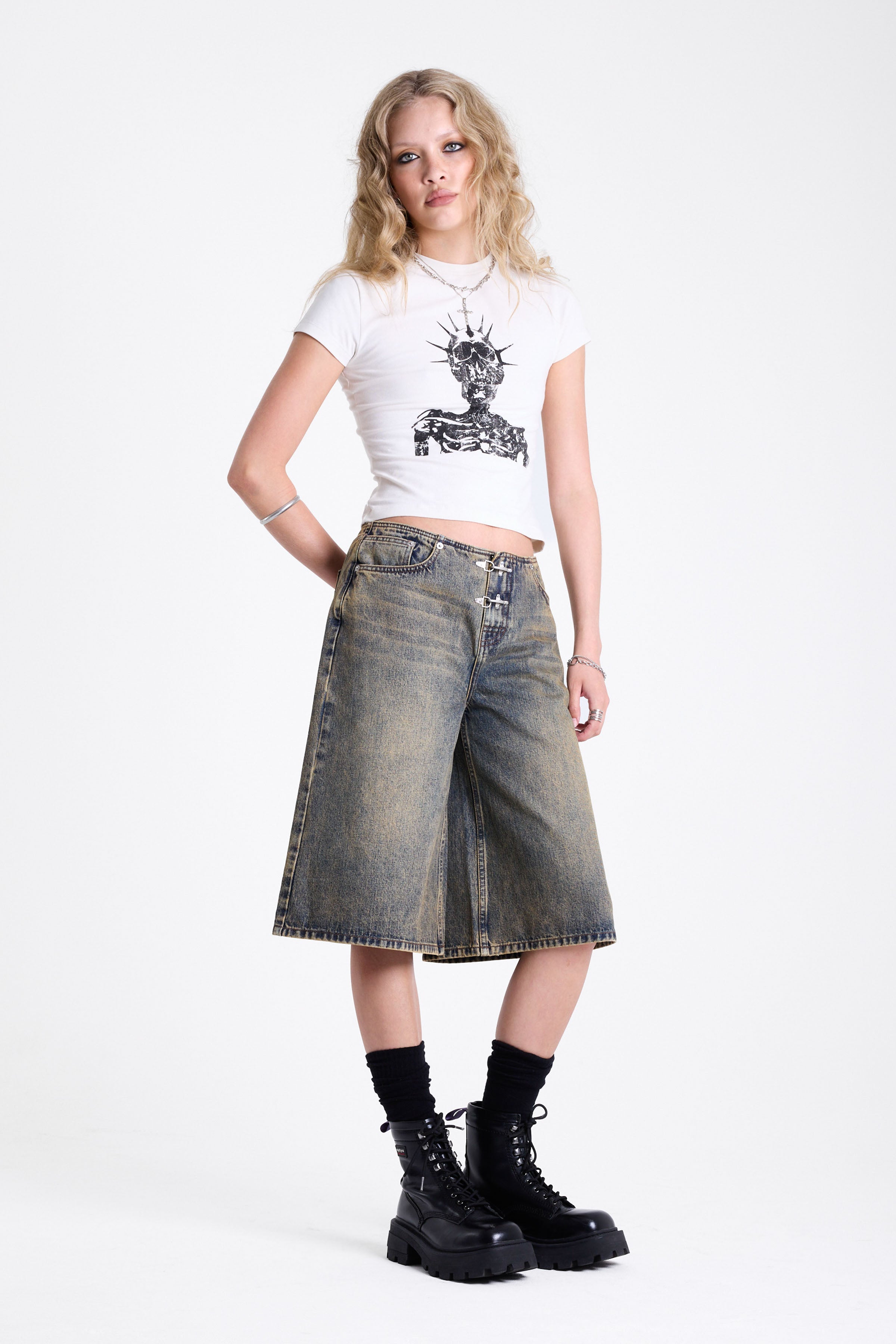 Dirty wash longline oversized denim jorts with no waistband and silver latch clasp detail, worn by model