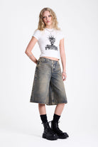 Dirty wash longline oversized denim jorts with no waistband and silver latch clasp detail, worn by model