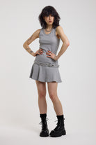 Grey mini dress with silver stud detail and eyelet detail belt, worn by model